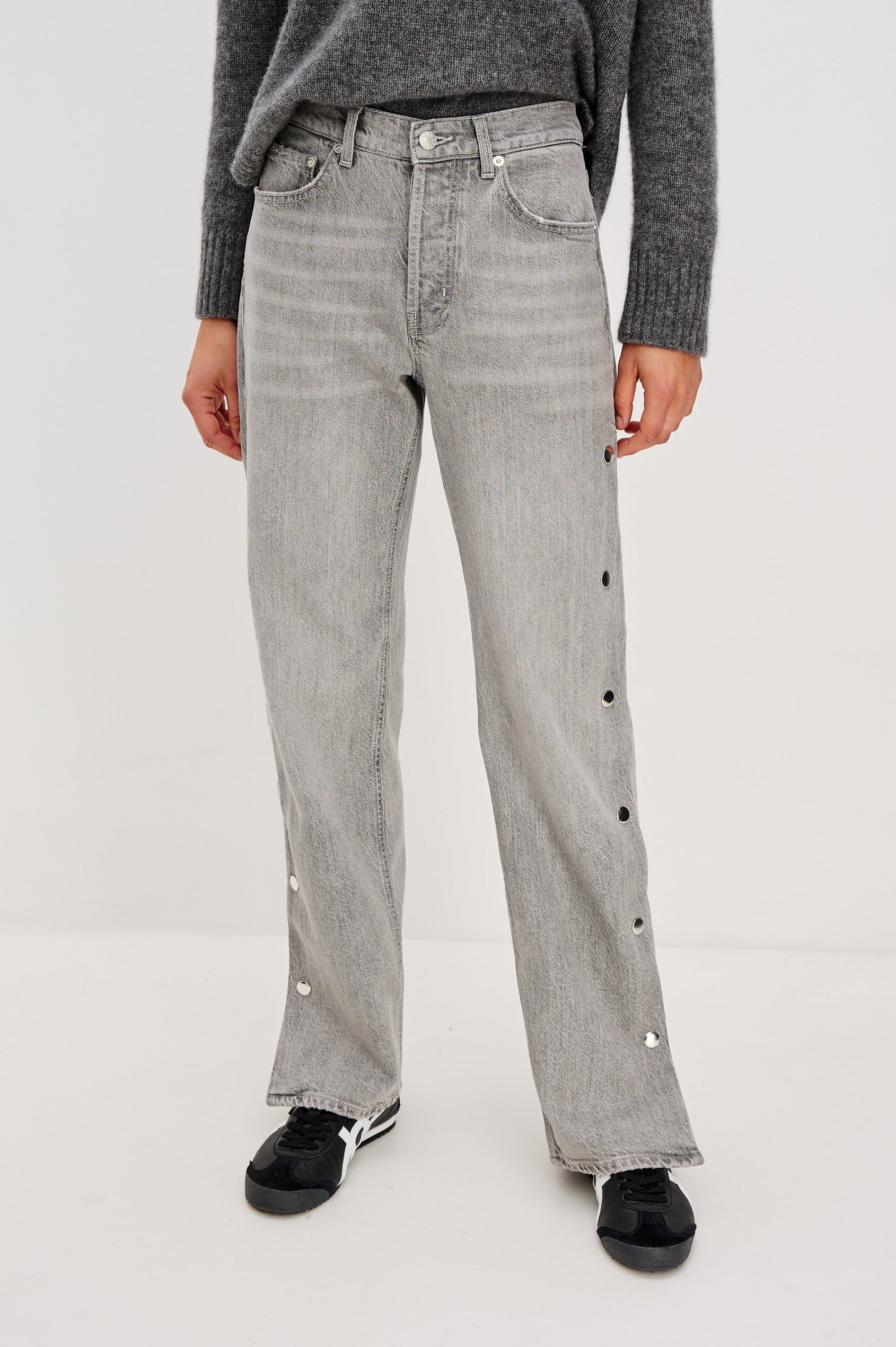 Del Mar low slung baggy boyfriend 5-pocket jean with silver metal studs on side seams and a slit at hem in a grey wash Stone Grey - front view featured on model.