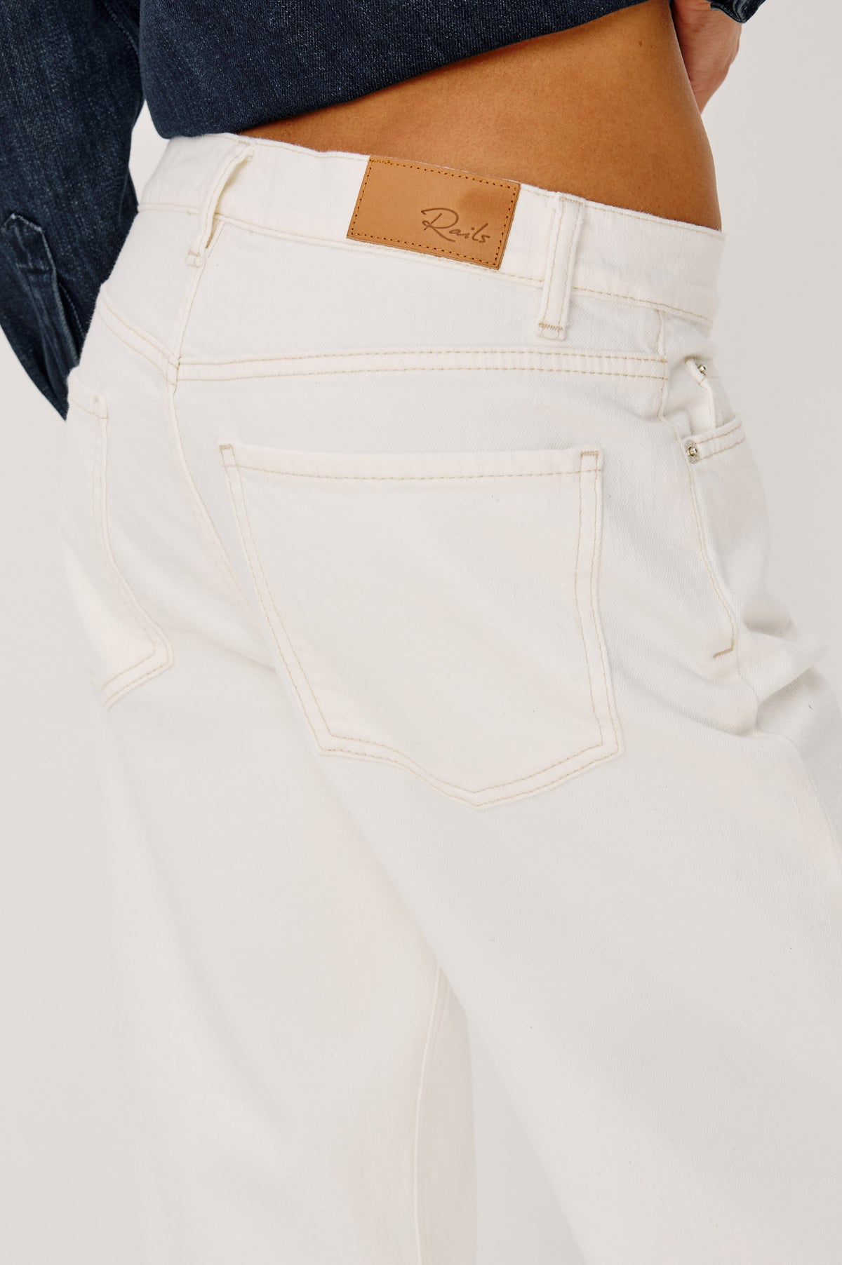 Del Mar Boyfriend Jean in Rigid Drapey Denim With Low-Slung Fit, Wide Relaxed Legs, 5-Pockets, and Button Fly in Vintage Ecru Colorway, Close-up Back View Featured on Model.