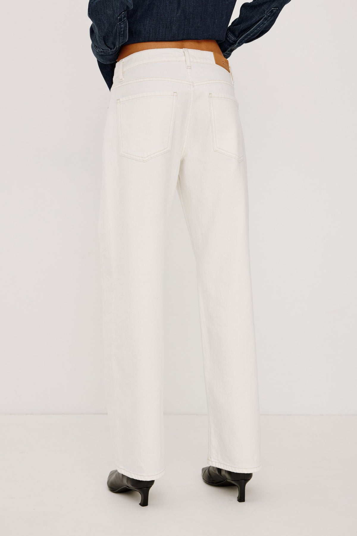 Del Mar Boyfriend Jean in Rigid Drapey Denim With Low-Slung Fit, Wide Relaxed Legs, 5-Pockets, and Button Fly in Vintage Ecru Colorway, Lower Body Back View Featured on Model.