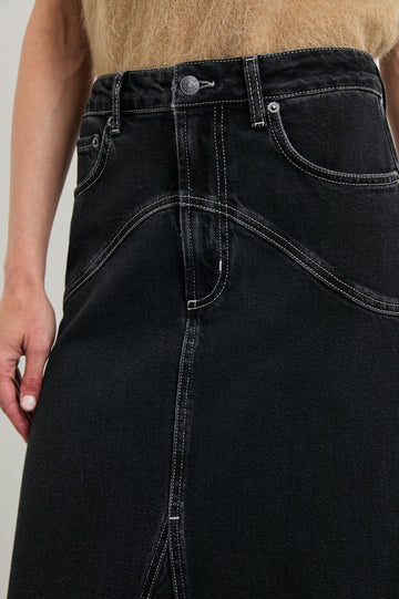 Del Rey Denim Midi Skirt with Western-Style Seams, Belt Loops, Two Front Pockets and Two Back Patch Pockets in Black Sand Colorway - Front View Featured on Model