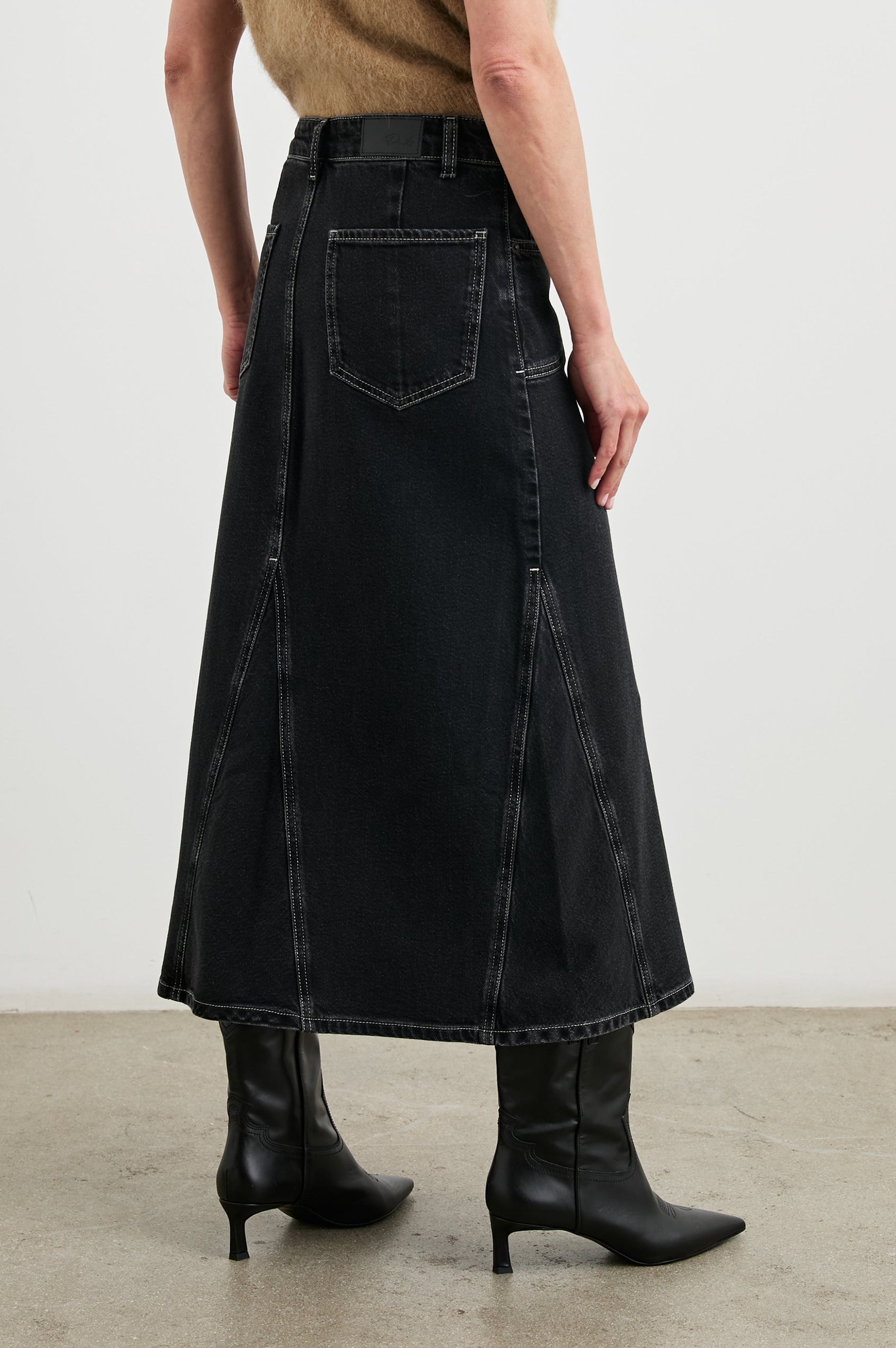 Del Rey Denim Midi Skirt with Western-Style Seams, Belt Loops, Two Front Pockets and Two Back Patch Pockets in Black Sand Colorway - Back View Featured on Model
