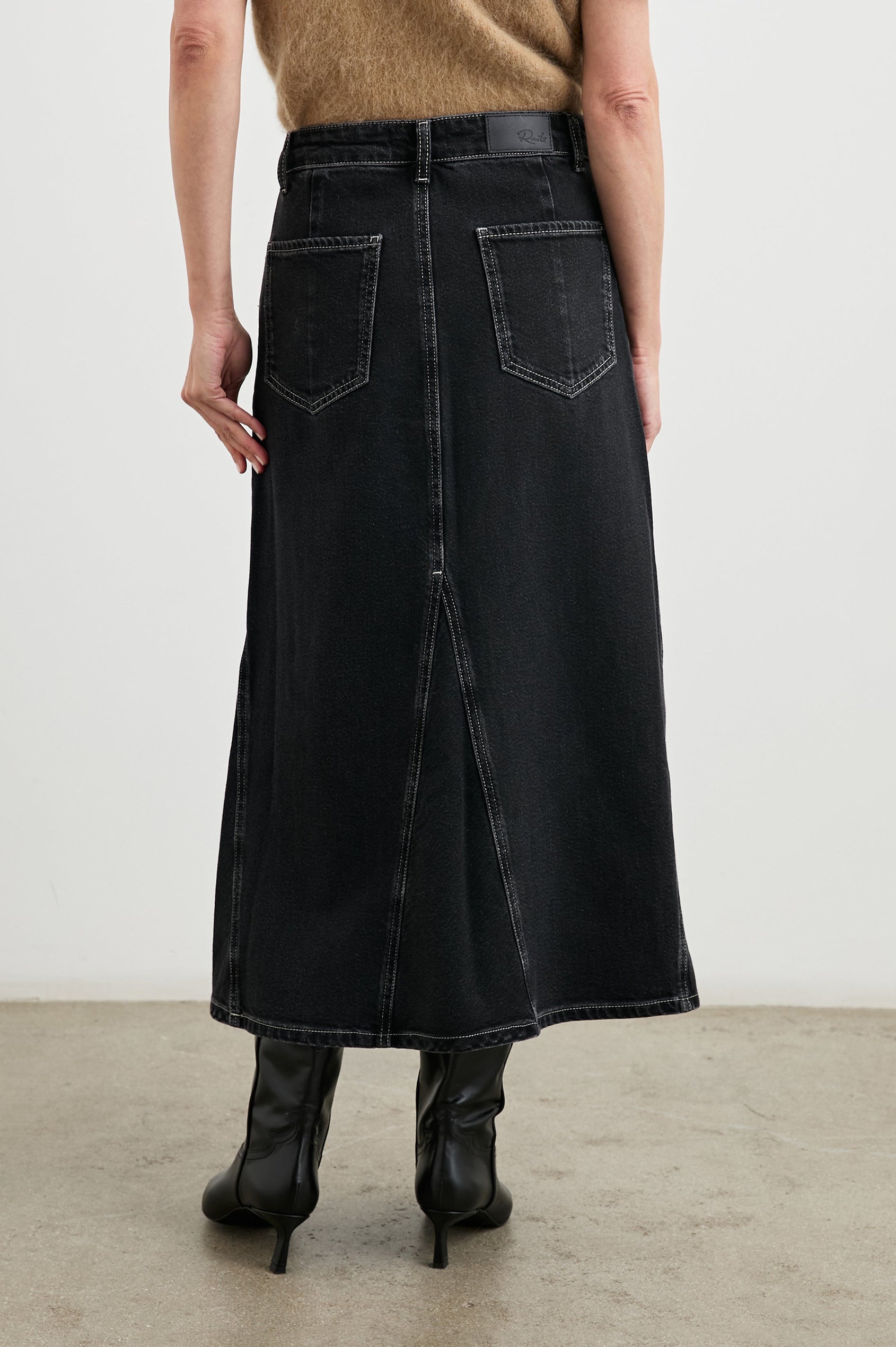 Del Rey Denim Midi Skirt with Western-Style Seams, Belt Loops, Two Front Pockets and Two Back Patch Pockets in Black Sand Colorway - Front View Featured on Model