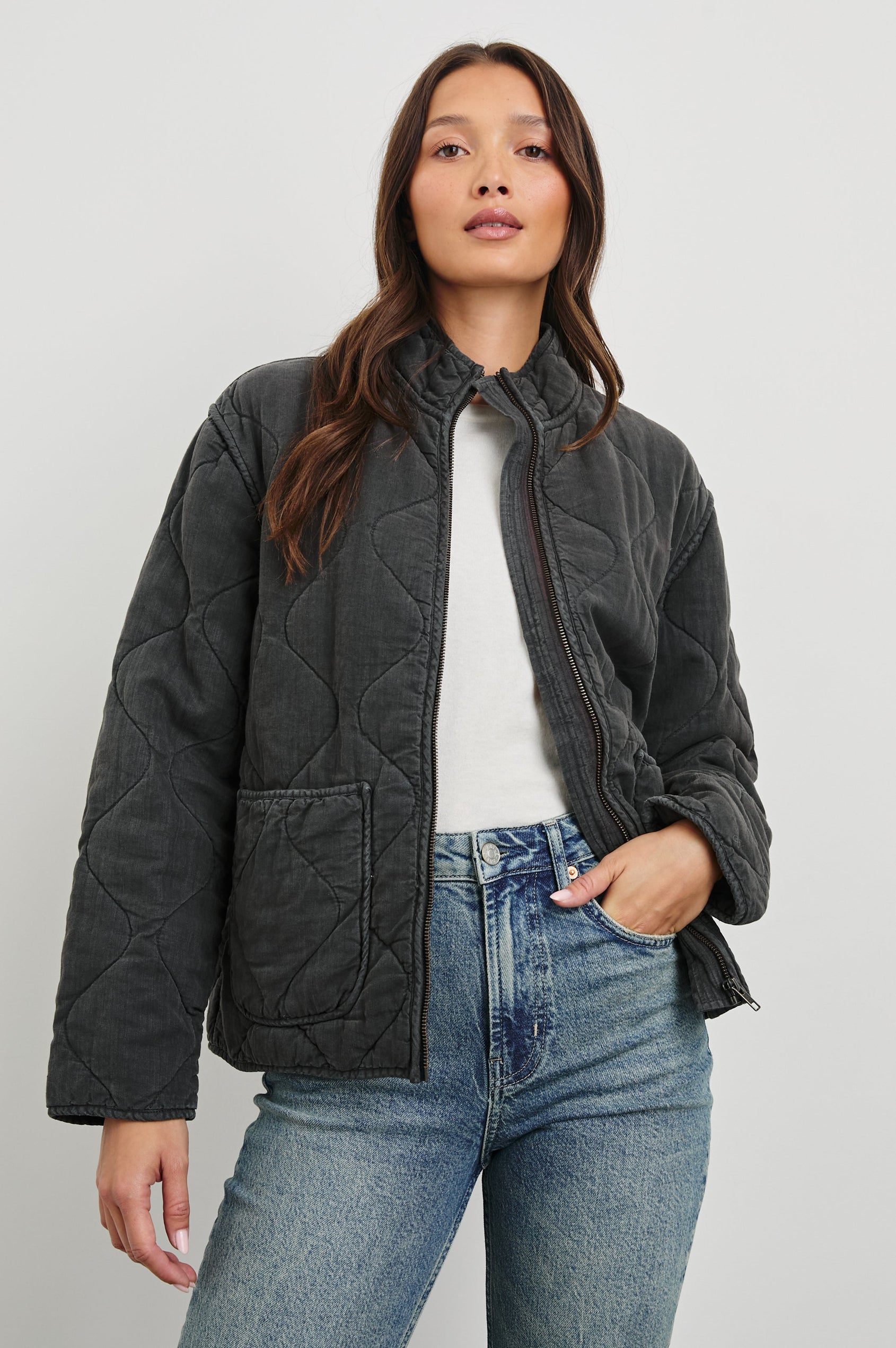 Denver Jacket with a Zip Up Closure, Two Front Patch Pockets and Quilted Stitching in Faded Black Colorway - Front View Featured on Model