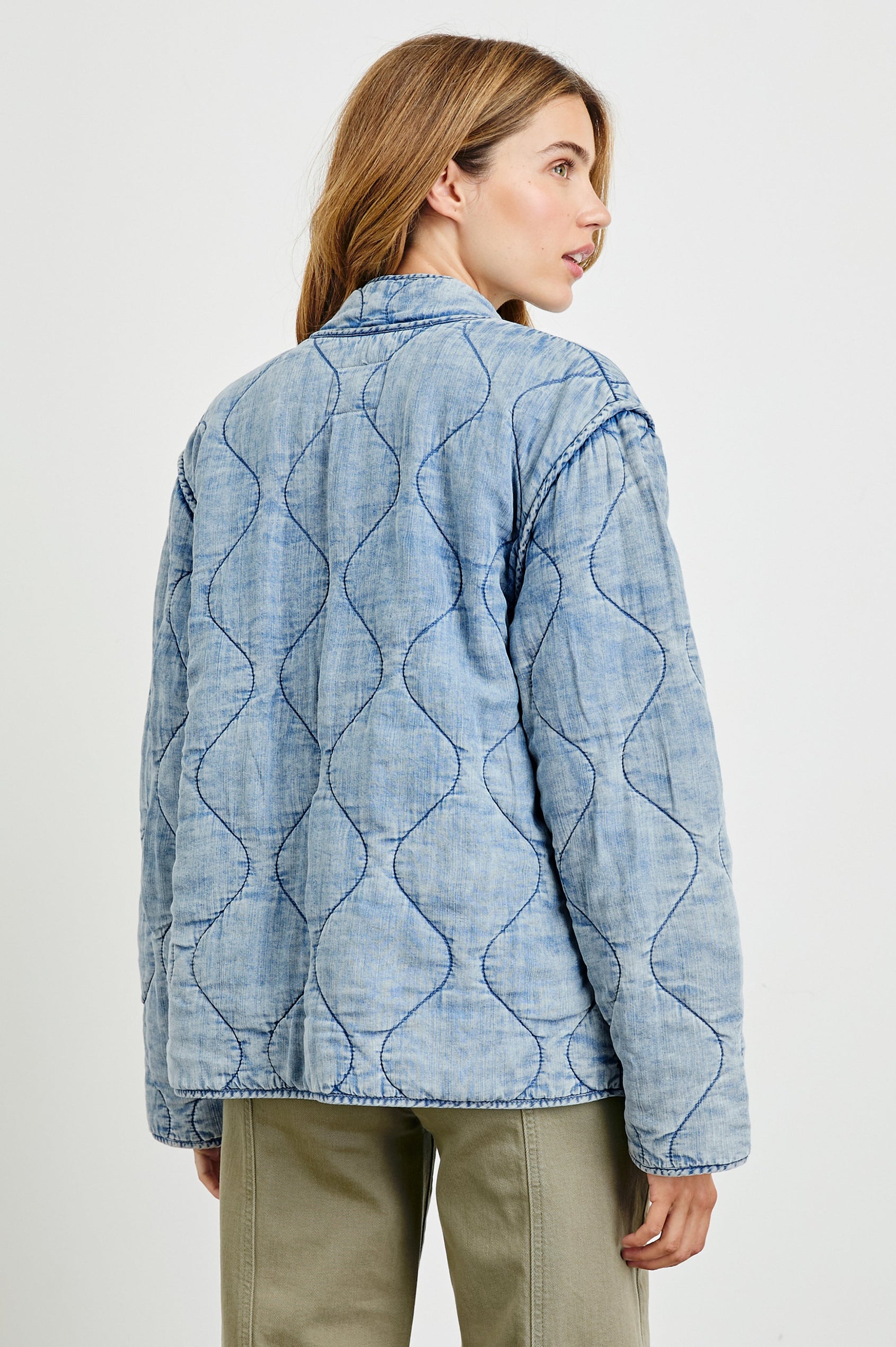 Denver Jacket with a Zip Up Closure, Two Front Patch Pockets and Quilted Stitching in Med Vintage Cloud Wash Colorway - Back View Featured on Model