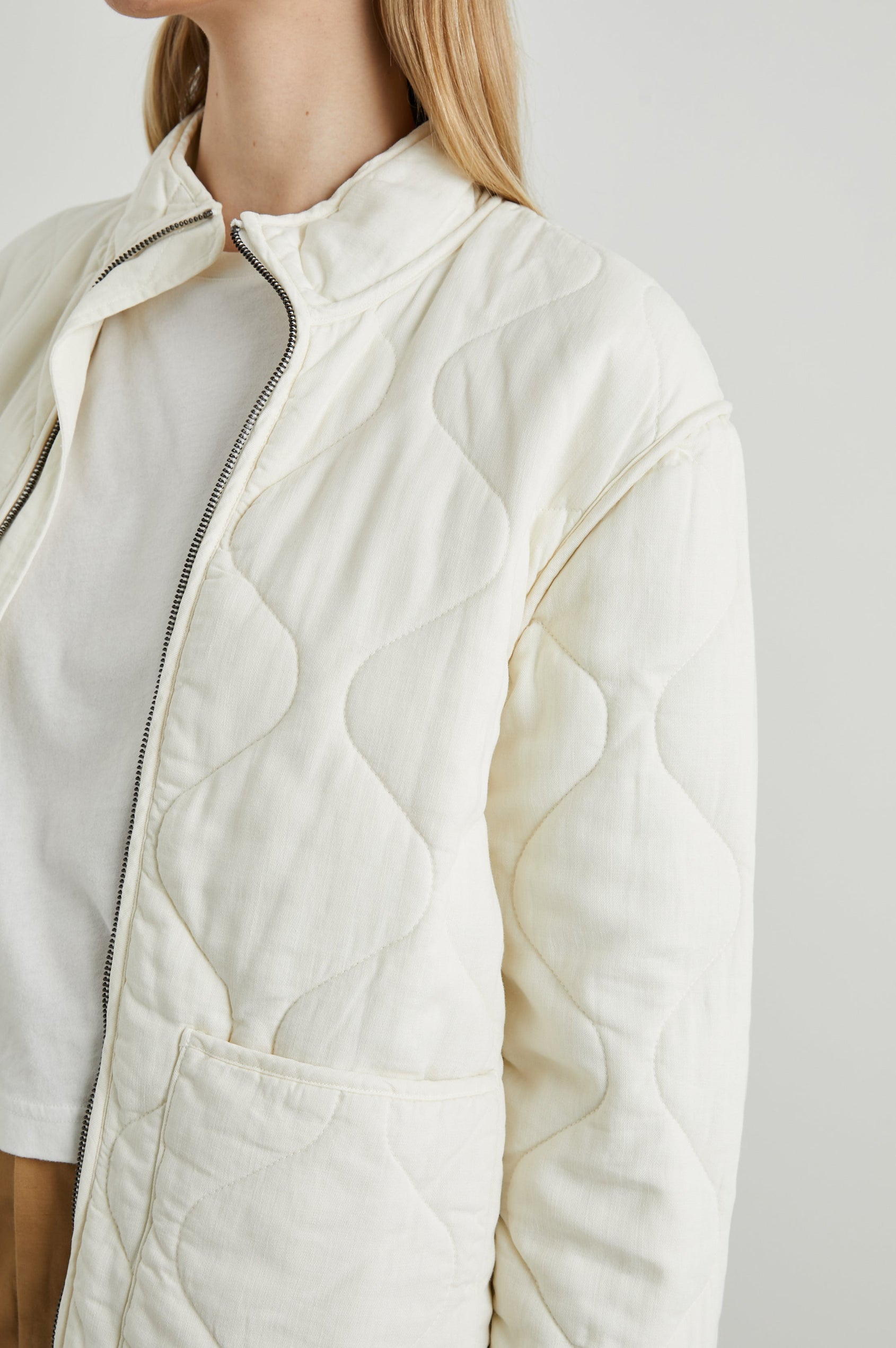 Denver Jacket with a Zip Up Closure, Two Front Patch Pockets and Quilted Stitching in Pearl Colorway - Front View Featured on Model