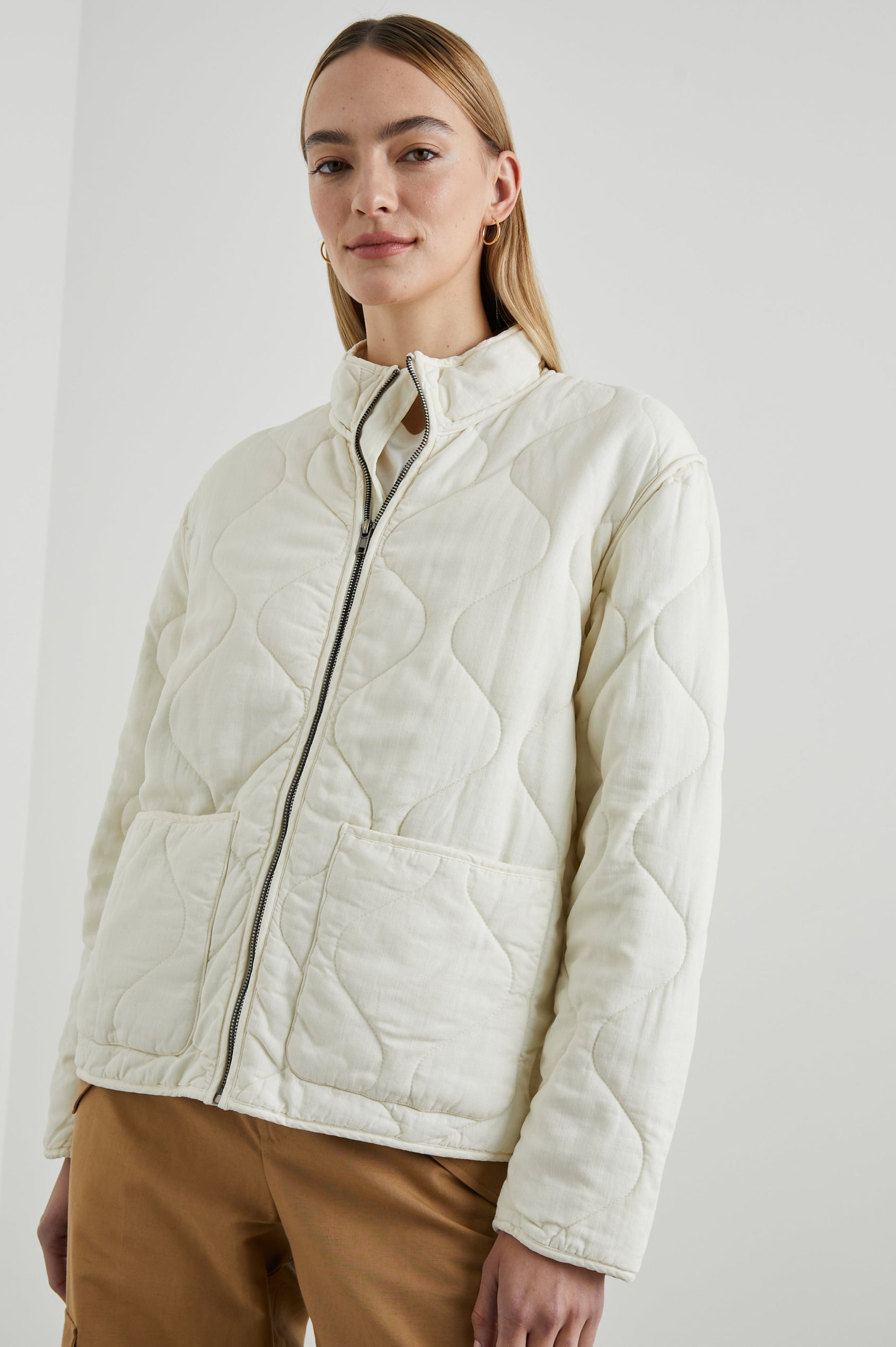 Denver Jacket with a Zip Up Closure, Two Front Patch Pockets and Quilted Stitching in Pearl Colorway - Front View Featured on Model