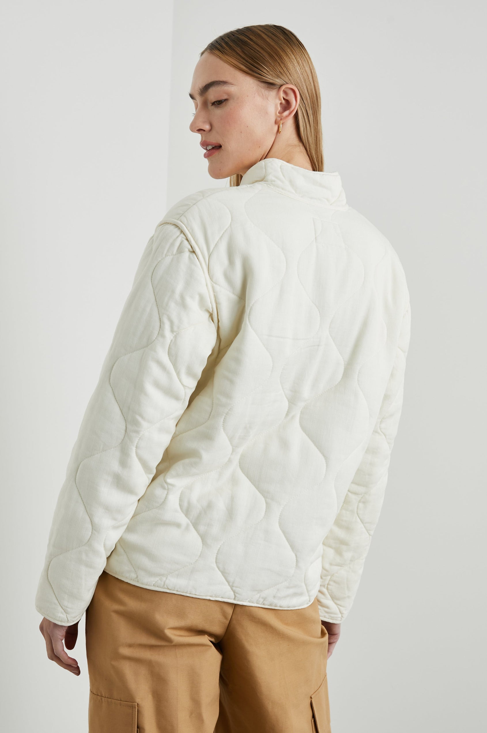 Denver Jacket with a Zip Up Closure, Two Front Patch Pockets and Quilted Stitching in Pearl Colorway - Back View Featured on Model