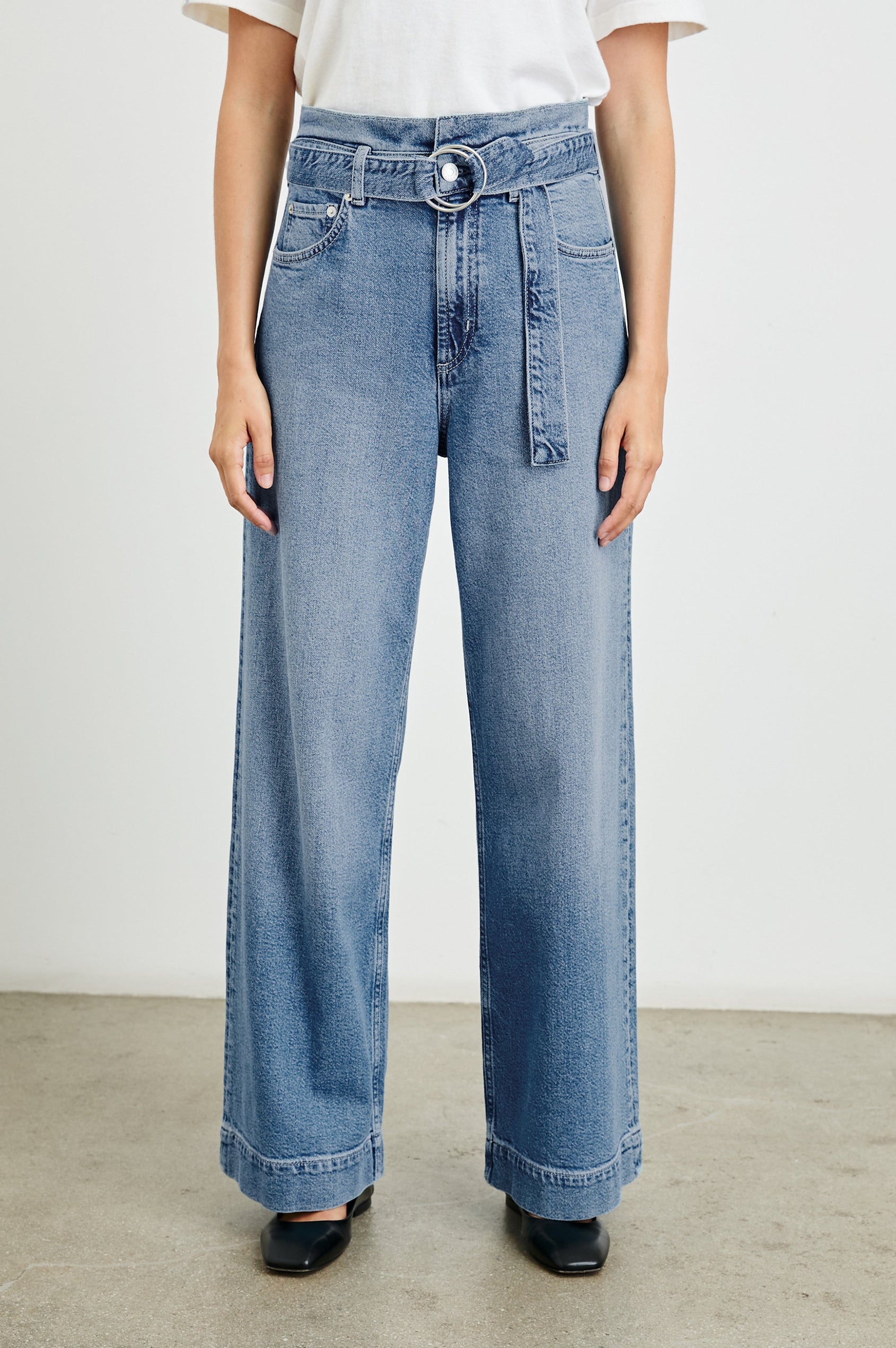 Descanso Wide Leg Denim Pants with Belt Loops, a Fabric O-Ring Belt, Two Front Pockets Plus a Coin Pocket and Two Back Patch Pockets in Cadet Blue Colorway - Front View Featured on Model