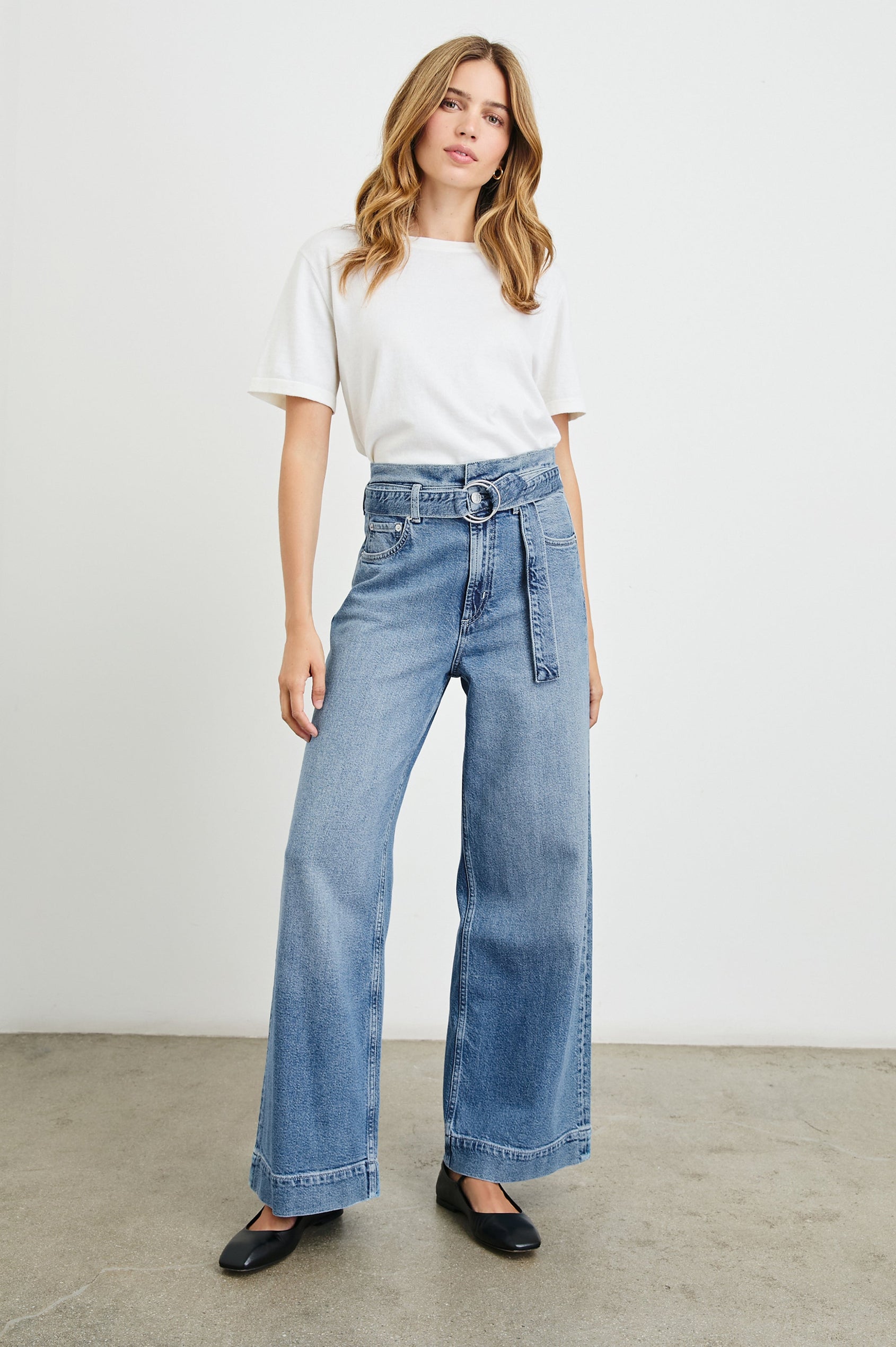 Descanso Wide Leg Denim Pants with Belt Loops, a Fabric O-Ring Belt, Two Front Pockets Plus a Coin Pocket and Two Back Patch Pockets in Cadet Blue Colorway - Front Full Body View Featured on Model