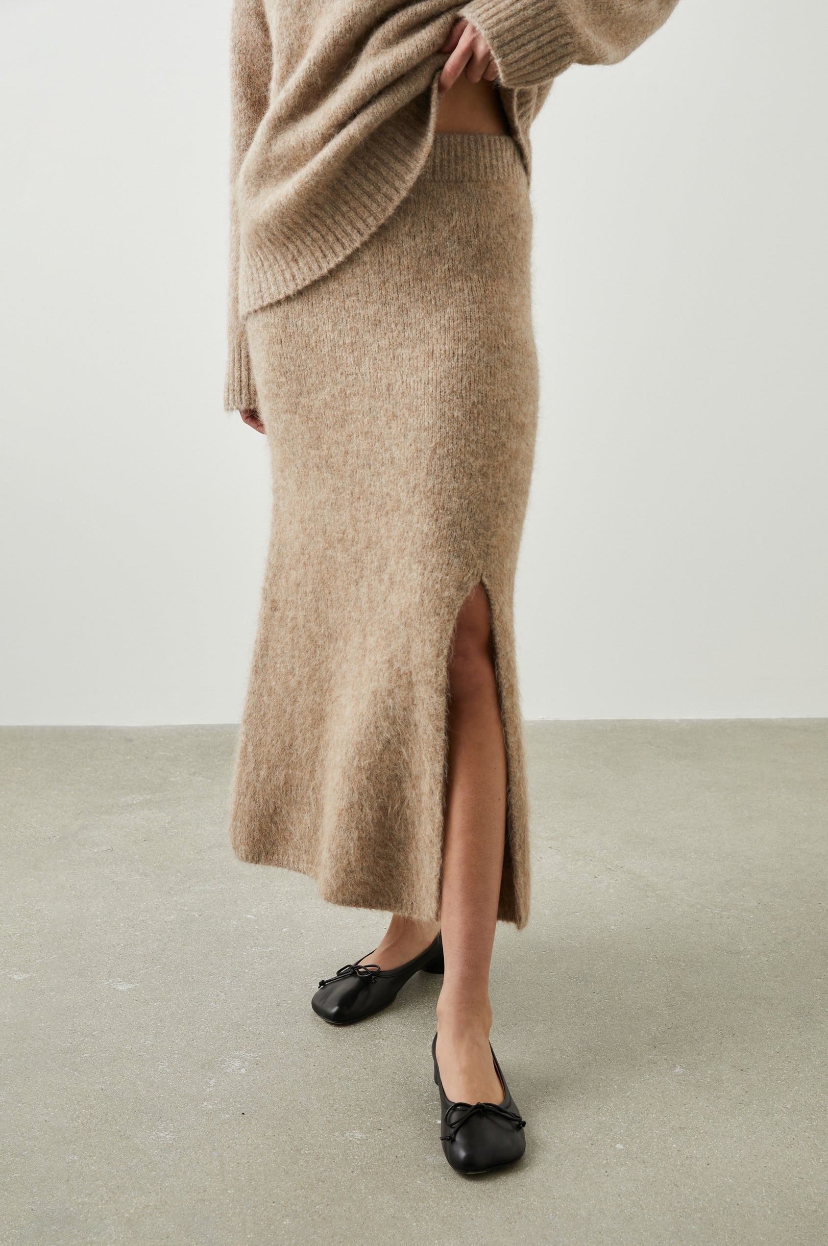 Diana Midi Skirt with a Side Slit and a Ribbed Waist in Oatmeal Colorway - Front View Featured on Model 