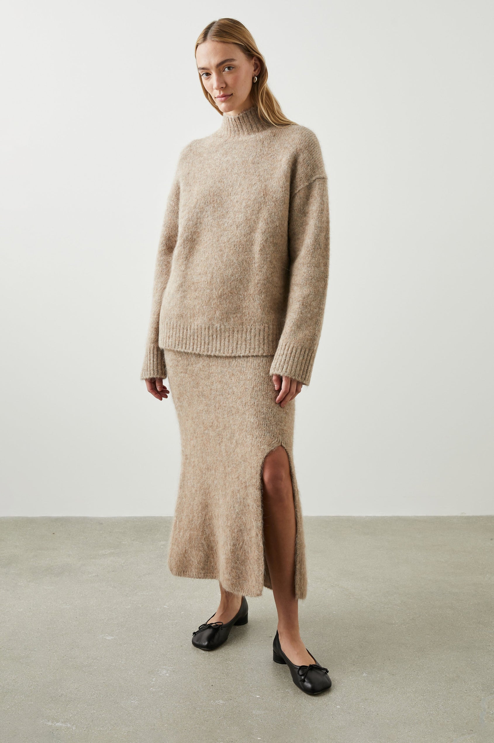 Diana Midi Skirt with a Side Slit and a Ribbed Waist in Oatmeal Colorway - Front Full Body View Featured on Model 