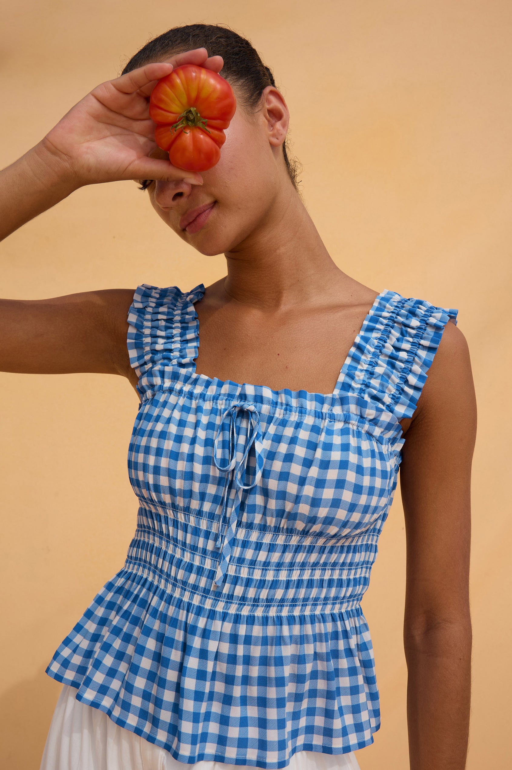 Donna Top With Square Neckline, Smocked Shouolder Straps, Center-Front Bust Ties, Smocked Waist, and Peplum Hem in Azure Gingham Colorway - Upper Body Front View Featured on Model