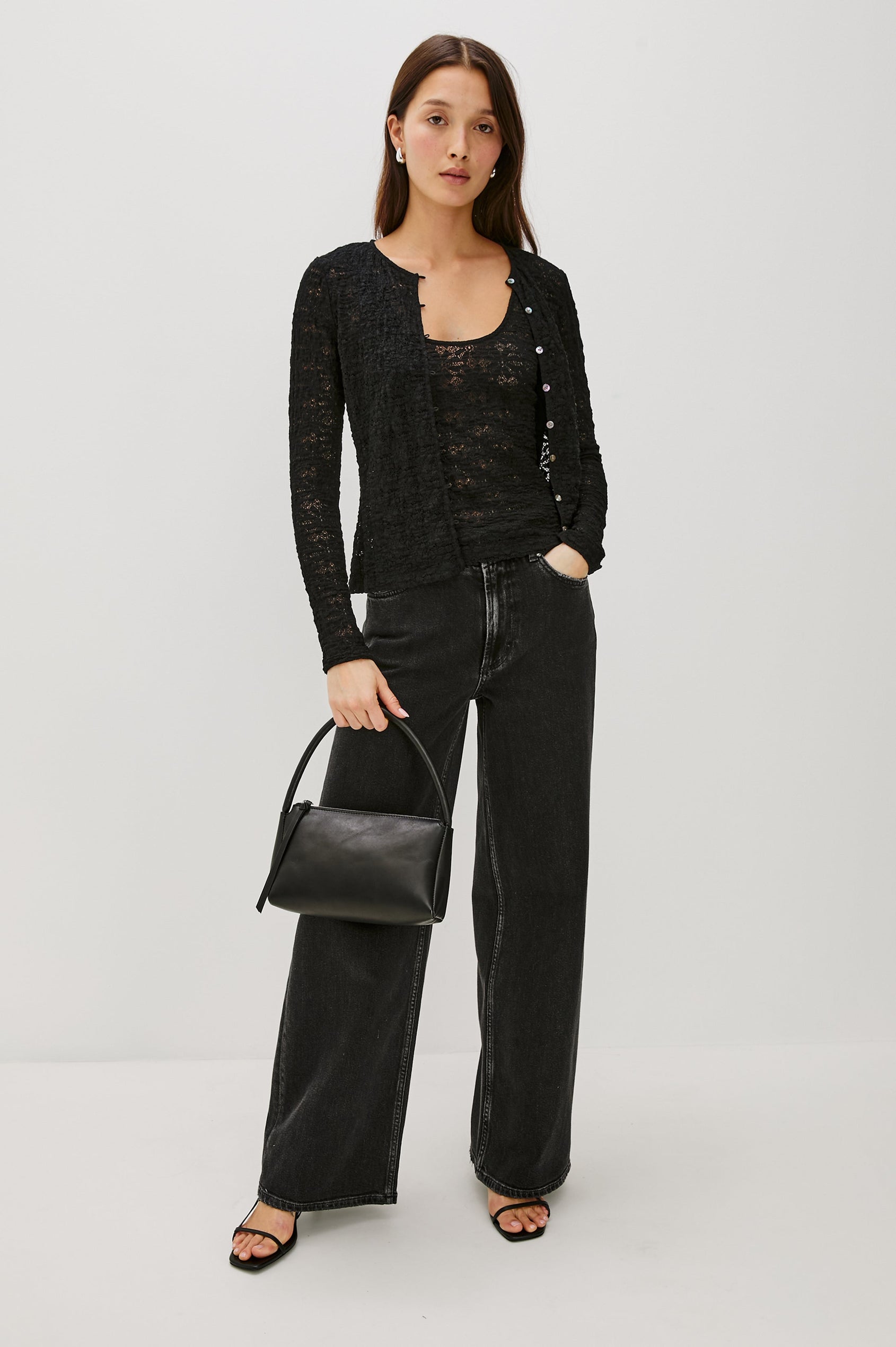 Donya is a sheer, unlined tank top with a scoop neckline in lace fabrication for added texture in Black Lace Colorway - Full Body Front View Featured on Model