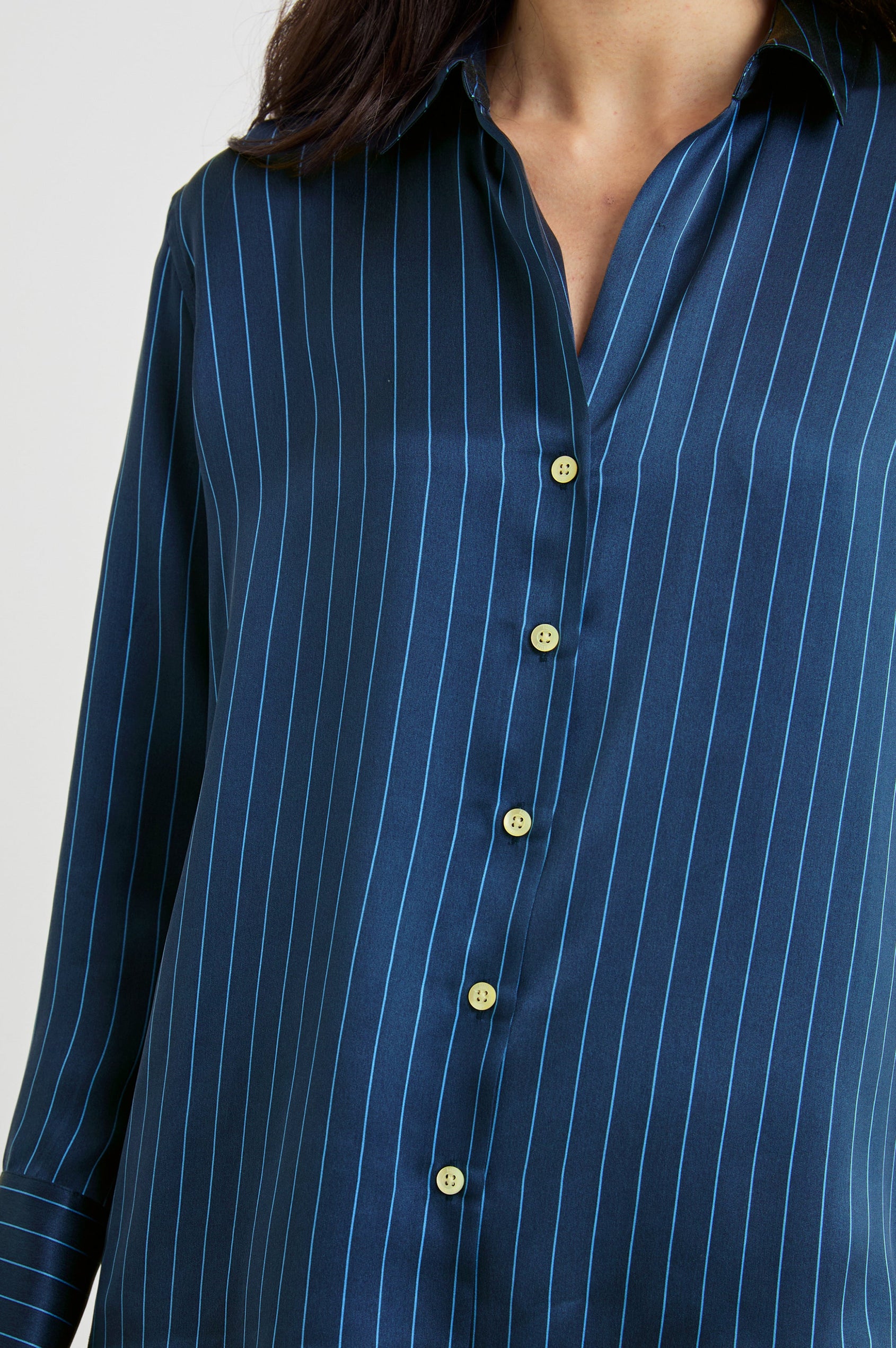 Dorian Long-Sleeve Button Up in Arctic Stripe Colorway, Vertical Stripes in Light and Dark Blue - Front View Featured on Model