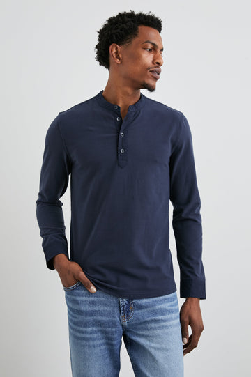 Dremond Long Sleeve Shirt with a Three Button Placket and Buttoned Cuffs in Perfect Navy Colorway - Front View Featured on Model