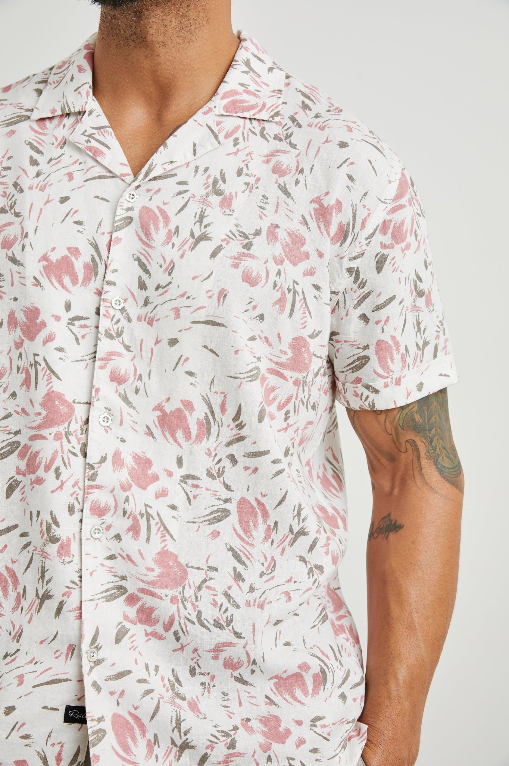 Dresden Short Sleeve Button Up with Rolled Cuffs in Brush Floral White Colorway, Pink and Brown Flowers on White - Front View Featured on Model