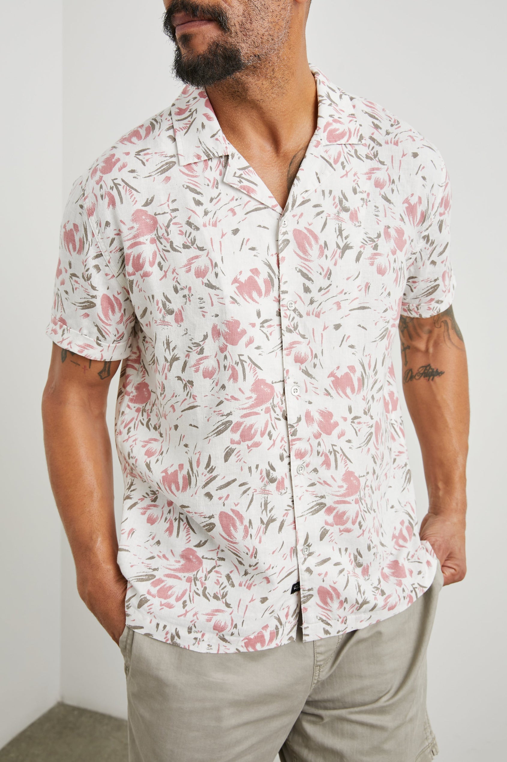 Dresden Short Sleeve Button Up with Rolled Cuffs in Brush Floral White Colorway, Pink and Brown Flowers on White - Front View Featured on Model