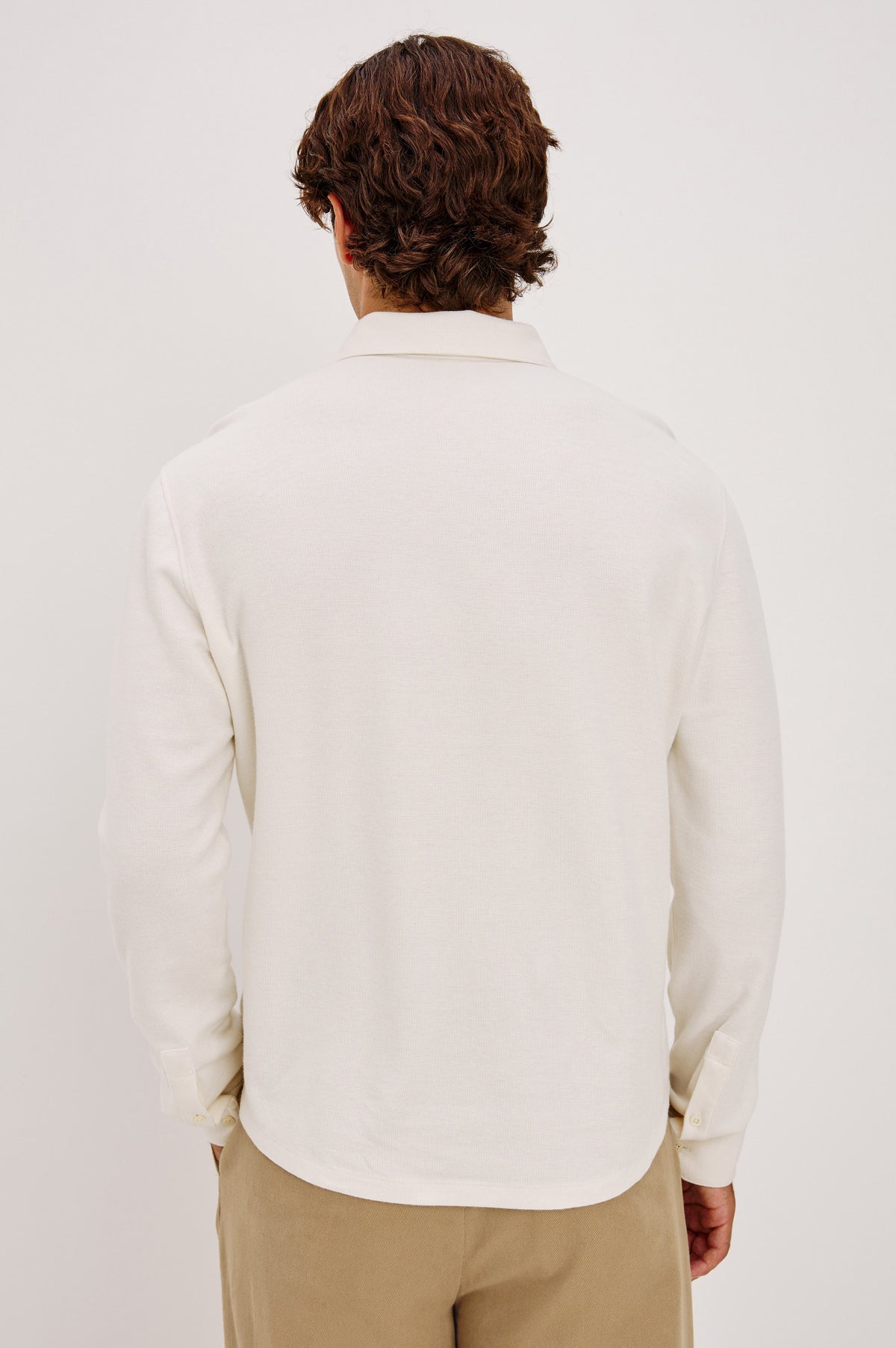 Dunn Shirt in Pique Knit With Front Buttons, Slim Fit, Collar, and Long Sleeves in White Colorway - Upper Body Back View Featured on Model.