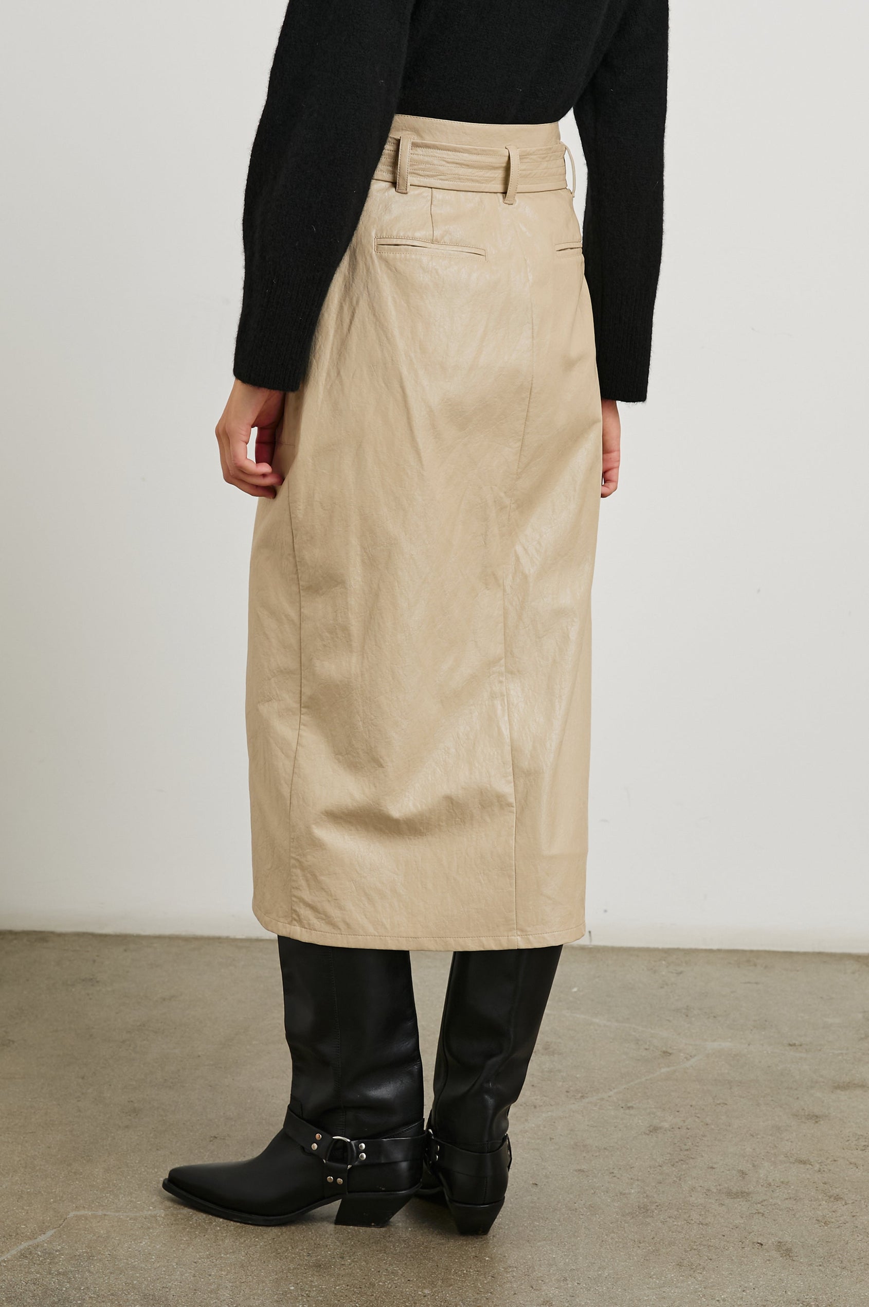 Edem Midi Skirt with a Tie Belt, a Center Slit, Four Button Closure at the Waist, Two Front Pockets Each Overlaid with a Button Flap Pocket and Two Back Welt Pockets in Dune Colorway, with Dark Brown Buttons - Back View Featured on Model