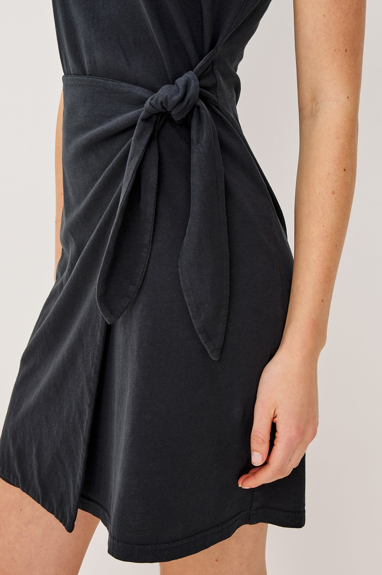 Edie Mini Dress in Sueded Cotton Jersey With Short Sleeves, Crew Neckline, and Adjustable Wrap Waist Ties in Black - Lower Body Detail View Featured on Model
