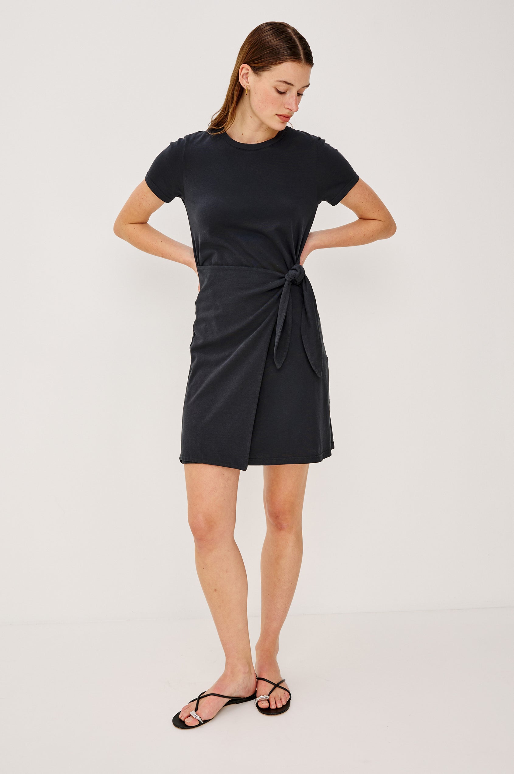 Edie Mini Dress in Sueded Cotton Jersey With Short Sleeves, Crew Neckline, and Adjustable Wrap Waist Ties in Black - Full Body Front View Featured on Model