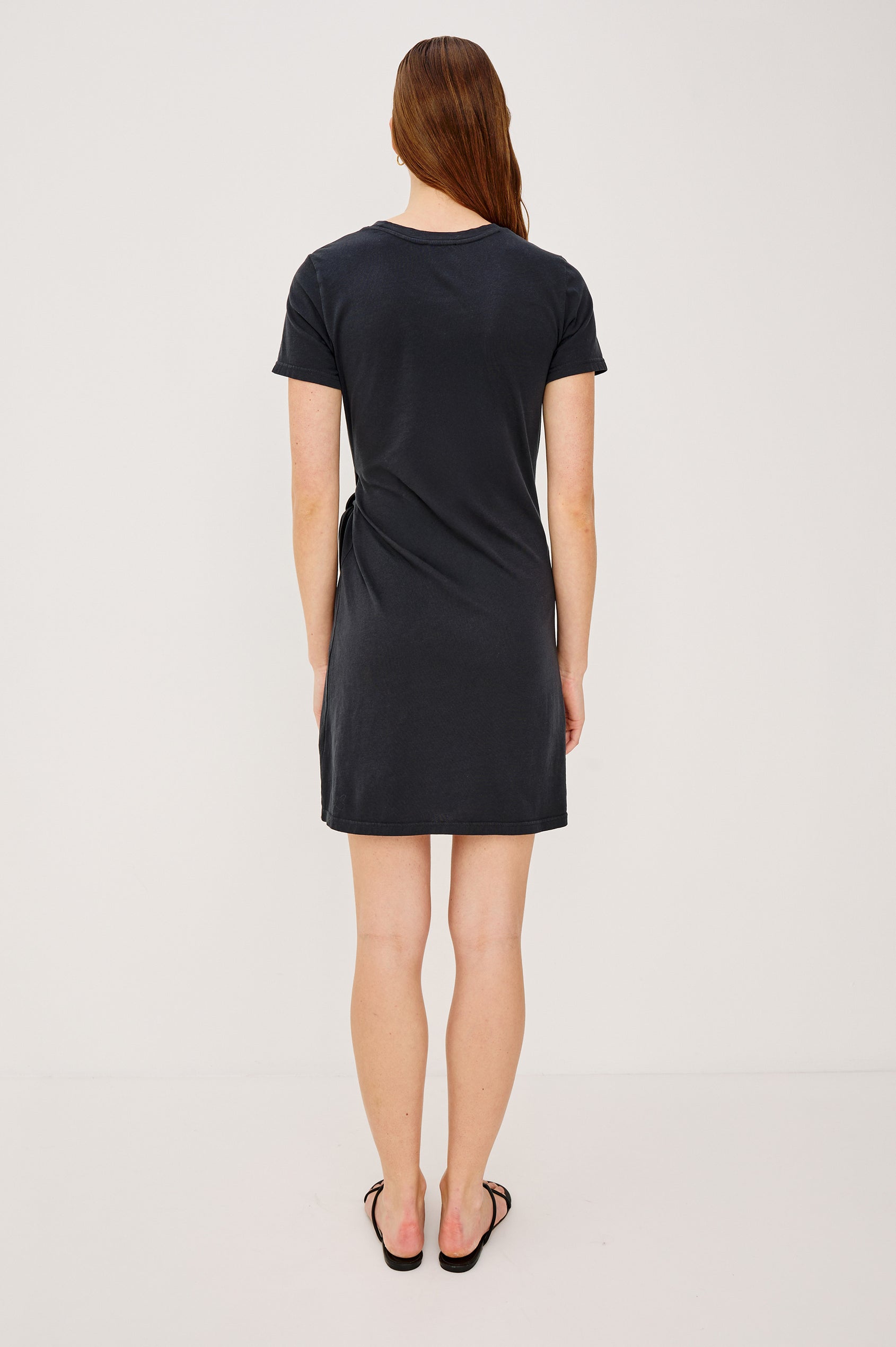 Edie Mini Dress in Sueded Cotton Jersey With Short Sleeves, Crew Neckline, and Adjustable Wrap Waist Ties in Black - Full Body Front View Featured on Model