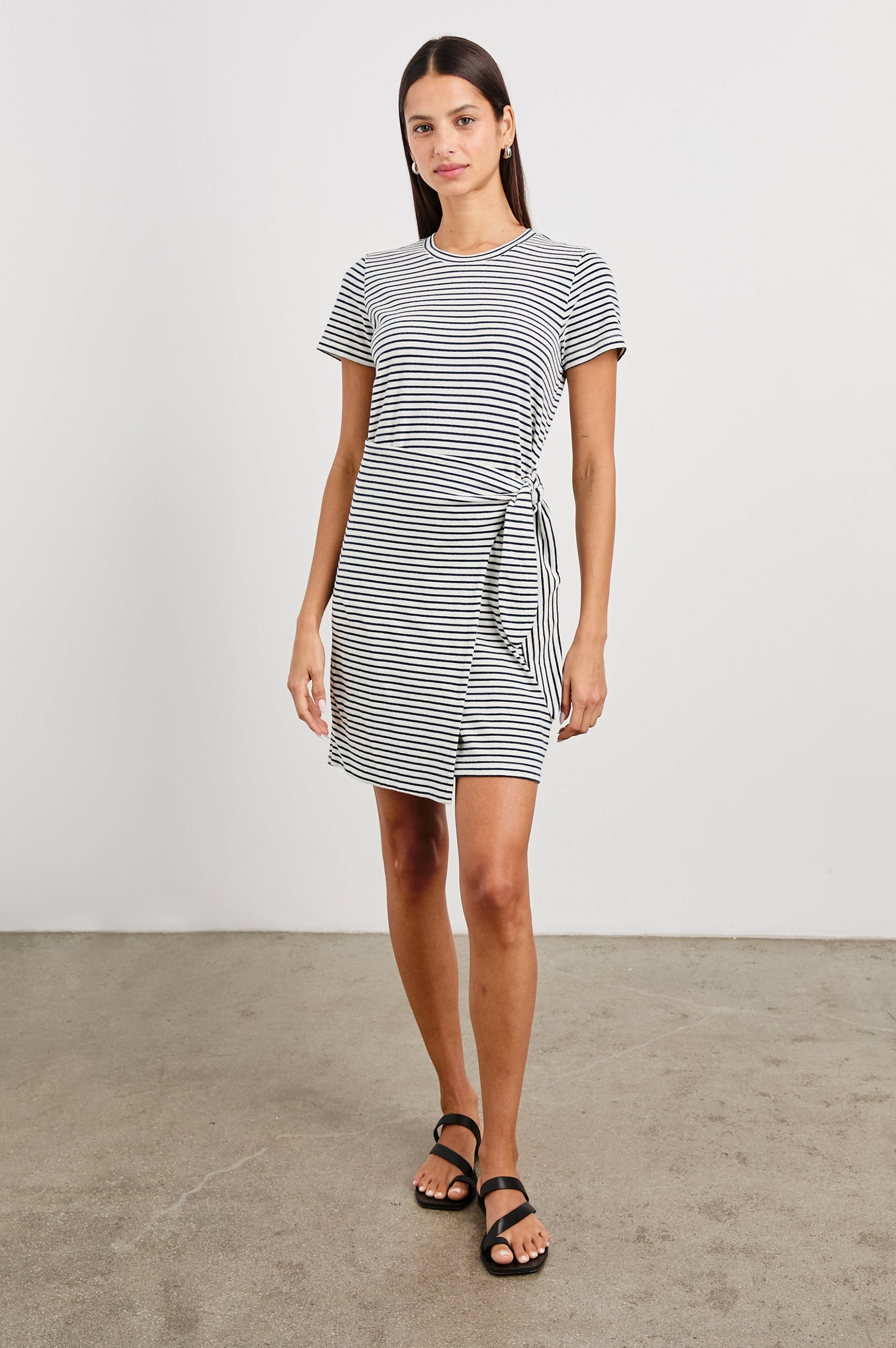 Edie Above-Knee Dress with Short Sleeves, Crew Neckline and Adjustable Wrap Tie At Waist in Ivory Navy Micro Stripe Colorway, Horizontal Stripes - Front Full Body View Featured on Model