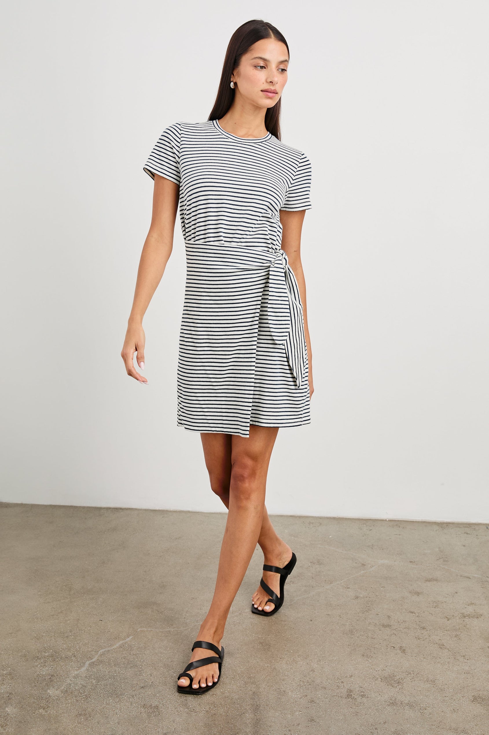 Edie Above-Knee Dress with Short Sleeves, Crew Neckline and Adjustable Wrap Tie At Waist in Ivory Navy Micro Stripe Colorway, Horizontal Stripes - Front Full Body View Featured on Model