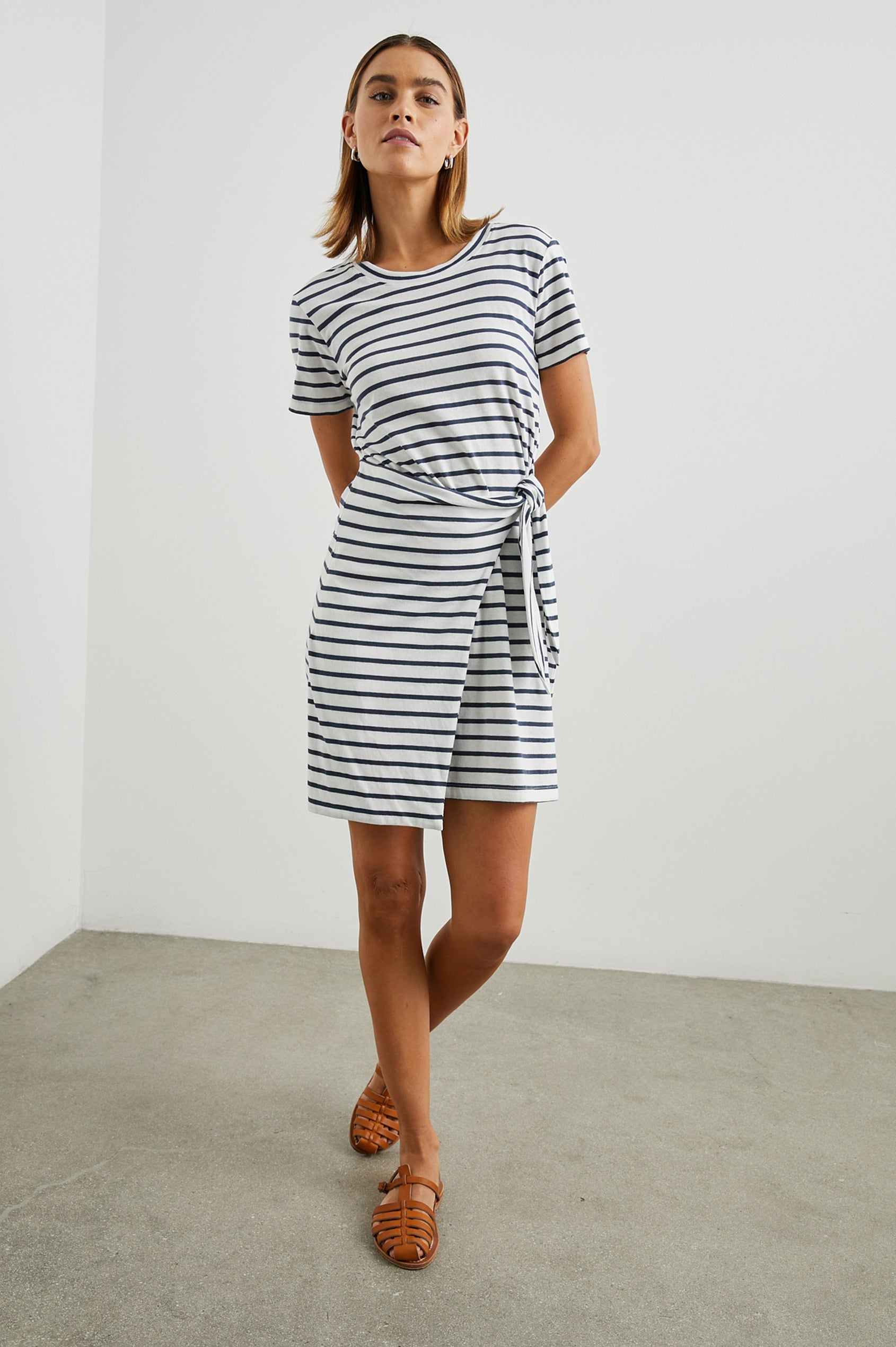 Edie Above-Knee Dress with Short Sleeves, Crew Neckline and Adjustable Wrap Tie At Waist in Ivory Navy Stripe Colorway, Horizontal Stripes - Front Full Body View Featured on Model