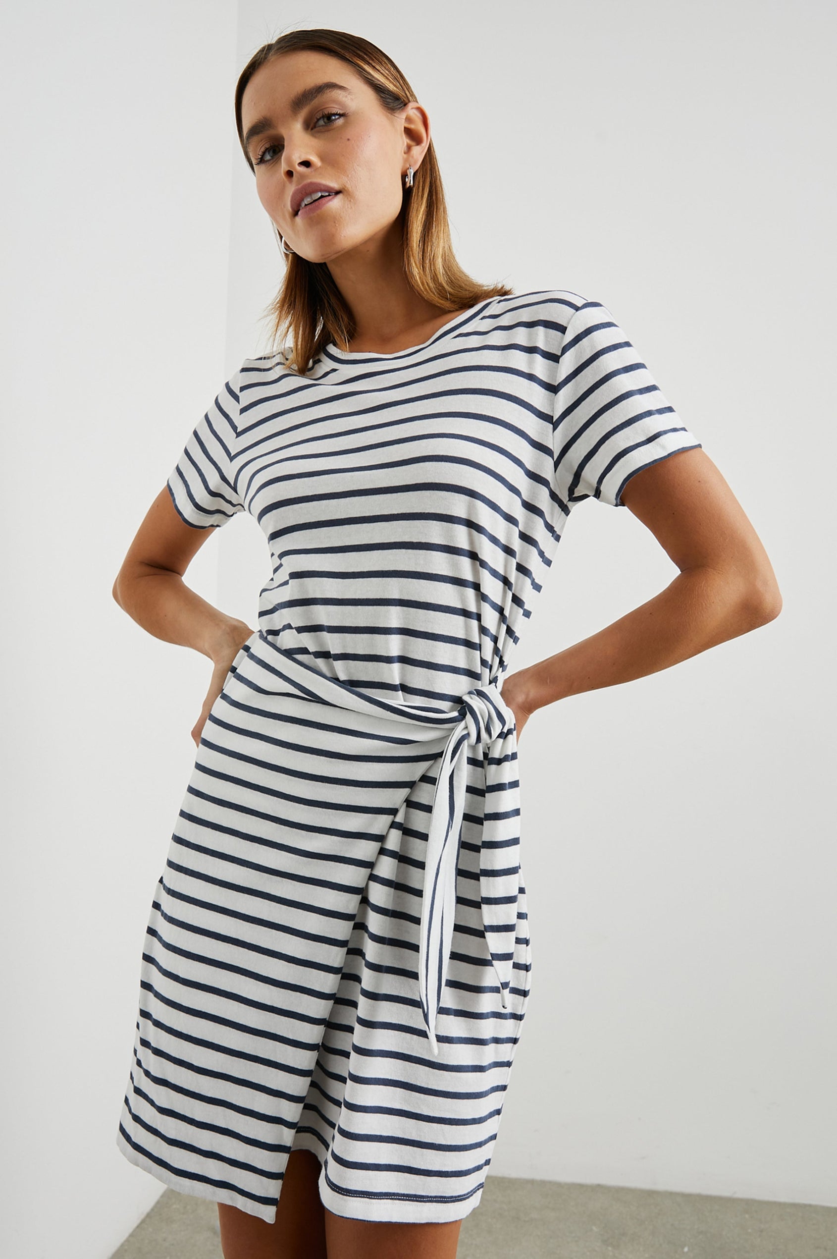 Edie Above-Knee Dress with Short Sleeves, Crew Neckline and Adjustable Wrap Tie At Waist in Ivory Navy Stripe Colorway, Horizontal Stripes - Front View Featured on Model