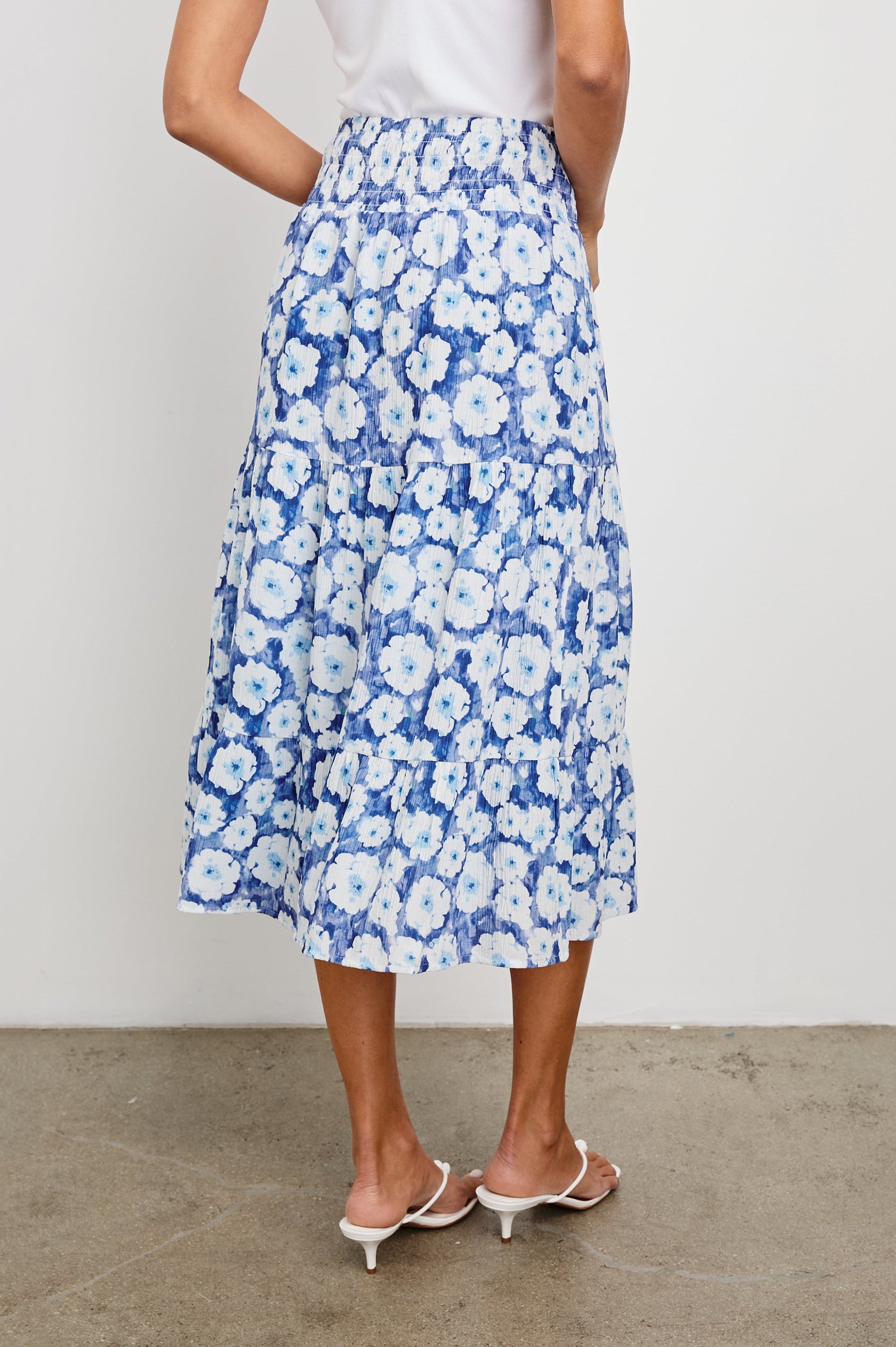 Edina Tiered Midi Skirt with Shirred High-Rise Waistline in Blue Floral Colorway, Blues and White - Front View Featured on Model