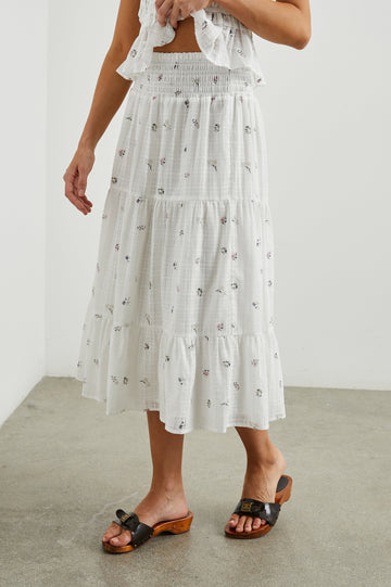 Edina Tiered Midi Skirt with Shirred High-Rise Waistline in Lilac Roses Colorway, with small flowers on white - Front View Featured on Model