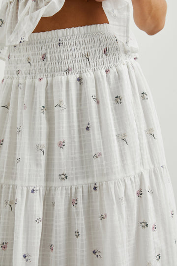 Edina Tiered Midi Skirt with Shirred High-Rise Waistline in Lilac Roses Colorway, with small flowers on white - Front View Featured on Model