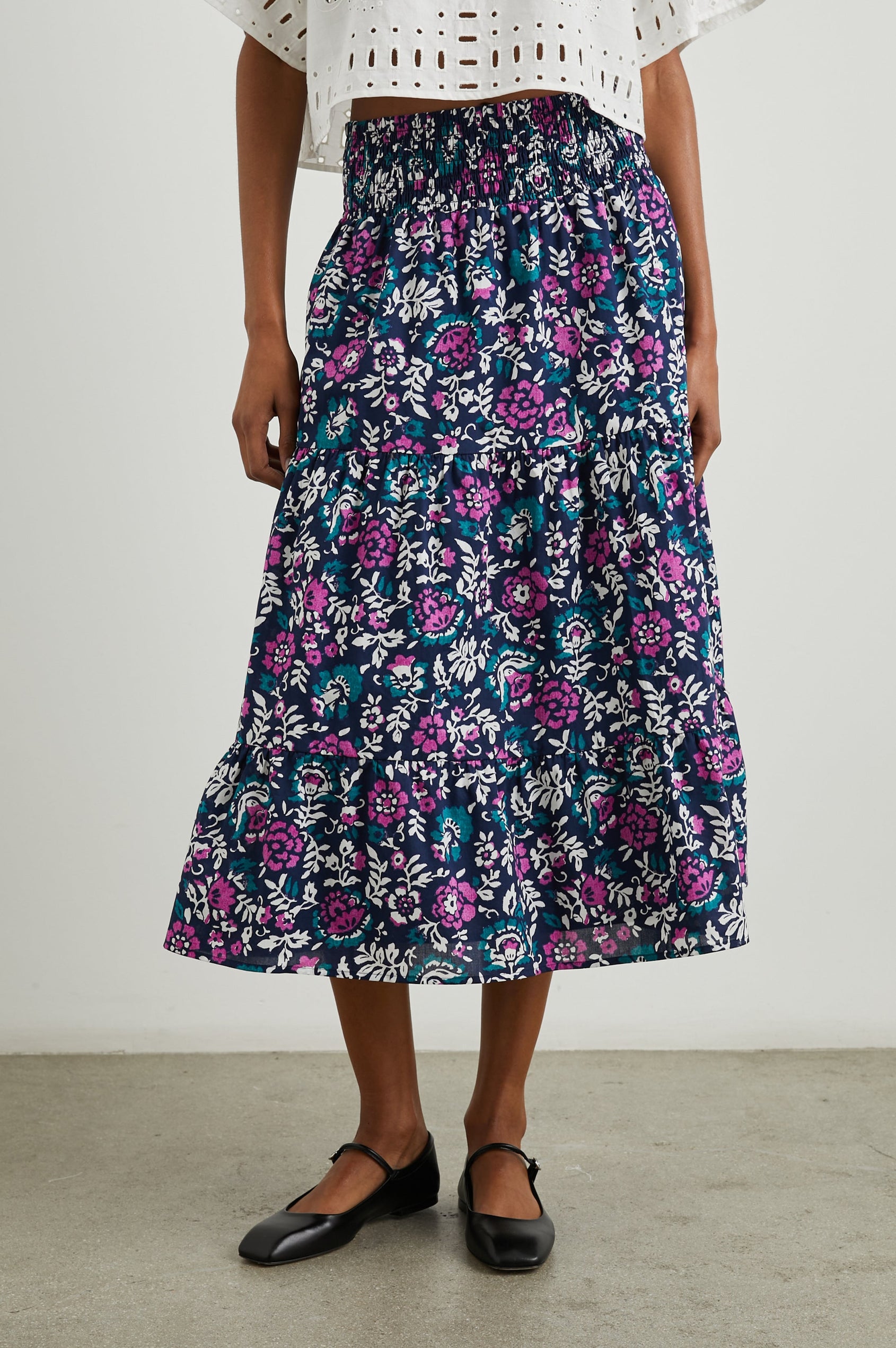 Edina Tiered Midi Skirt with Shirred High-Rise Waistline in Lilac Roses Colorway, with large flowers in purples, blues, and white - Front View Featured on Model