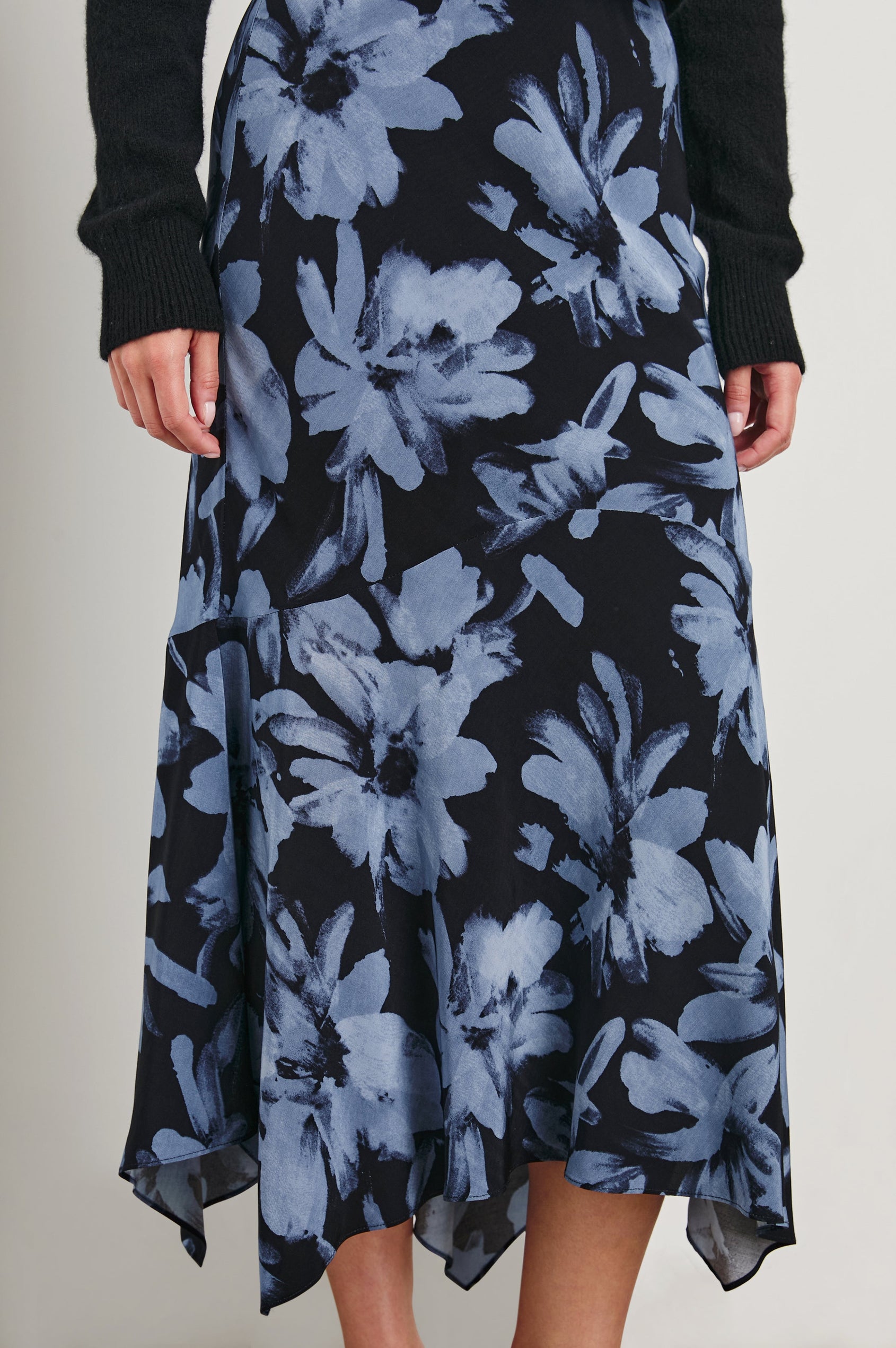 Edwina Midi Skirt with a Handkerchief Hem in Midnight Lily Colorway, Blue Lillies on Midnight - Front View Featured on Model