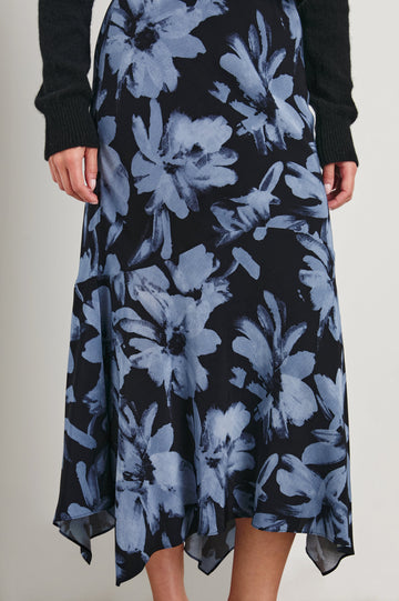Edwina Midi Skirt with a Handkerchief Hem in Midnight Lily Colorway, Blue Lillies on Midnight - Front View Featured on Model
