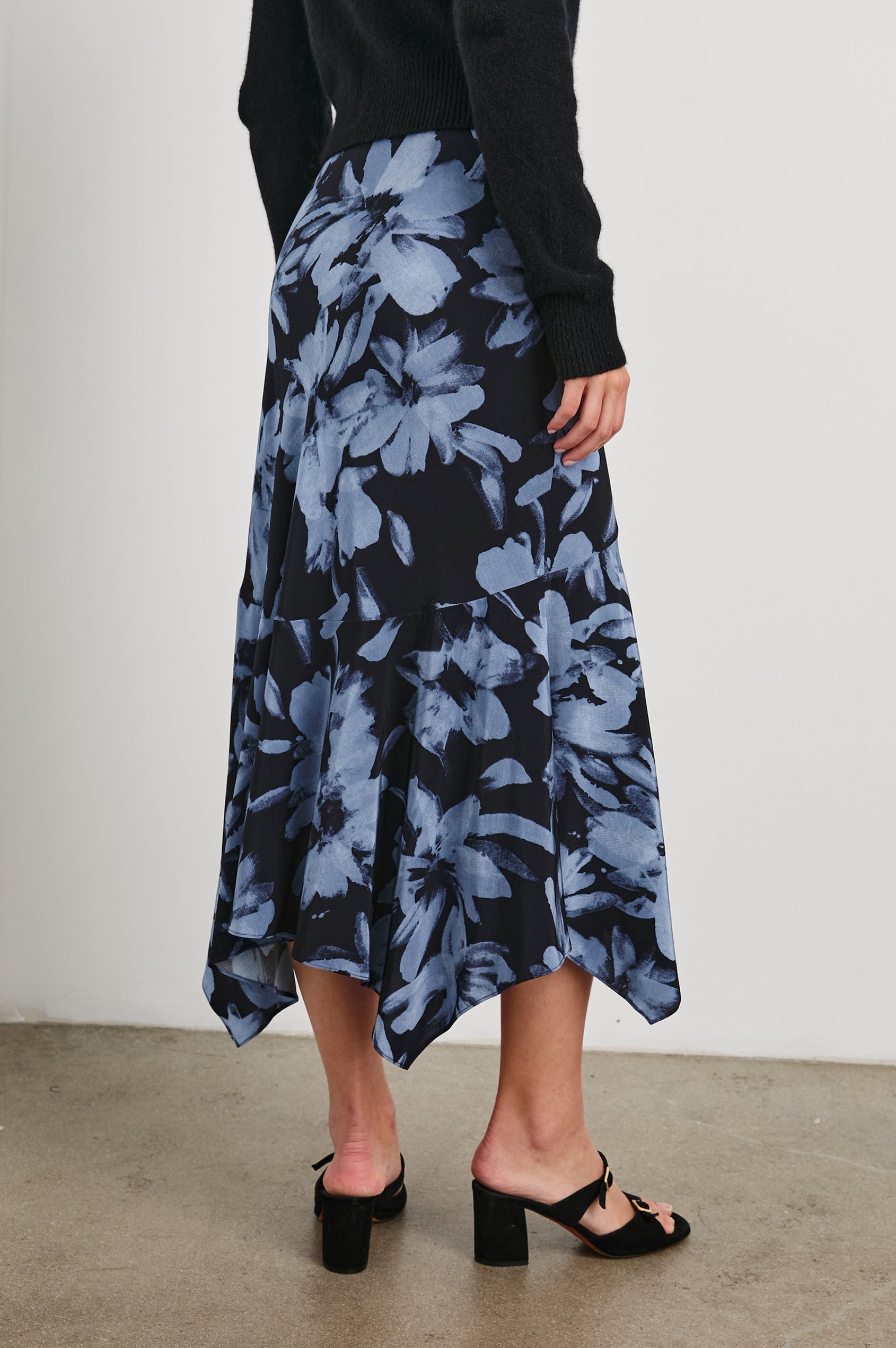 Edwina Midi Skirt with a Handkerchief Hem in Midnight Lily Colorway, Blue Lillies on Midnight - Back View Featured on Model