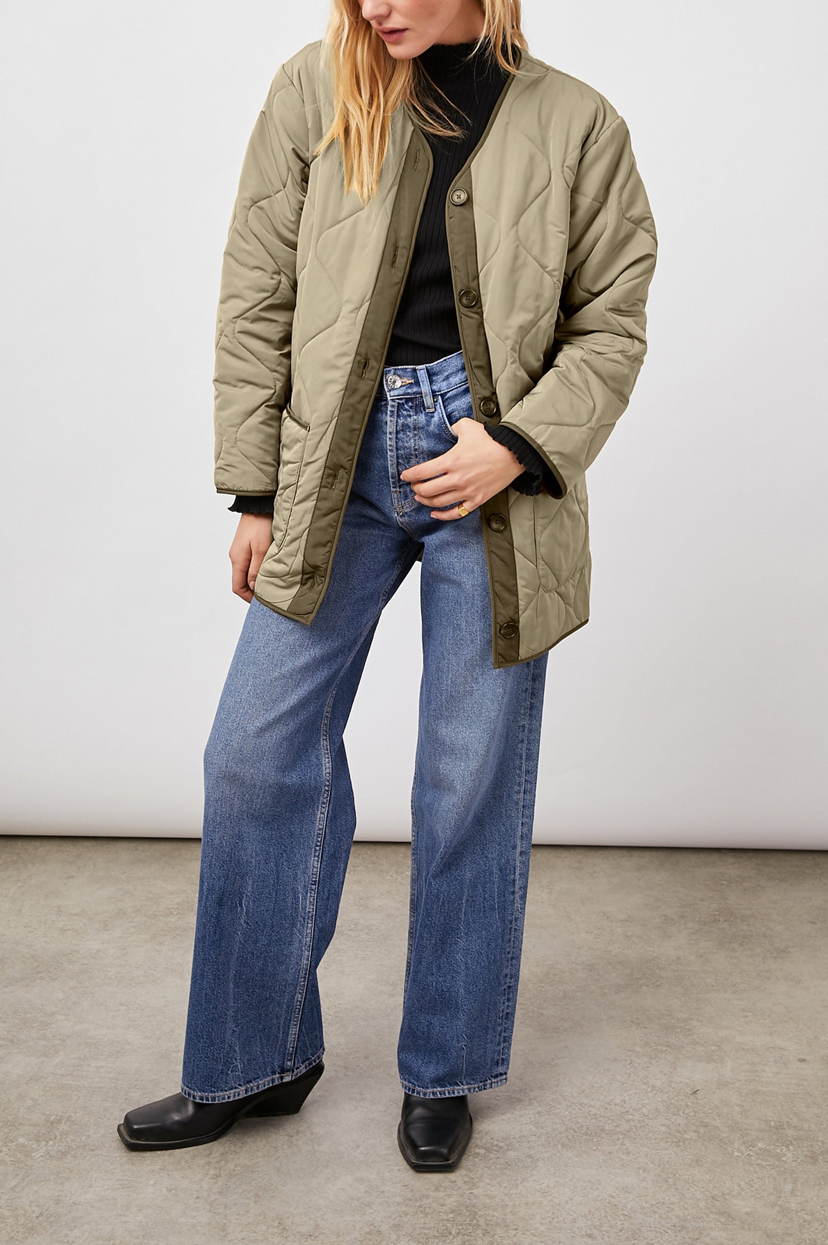 Elin Quilted Jacket with Button Closure, Side Slits, Low High Hem, Two Front Patch Pockets, and No Collar in Sage Colorway, with Darker Placket and Cuffs - Front Full Body View Featured on Model 