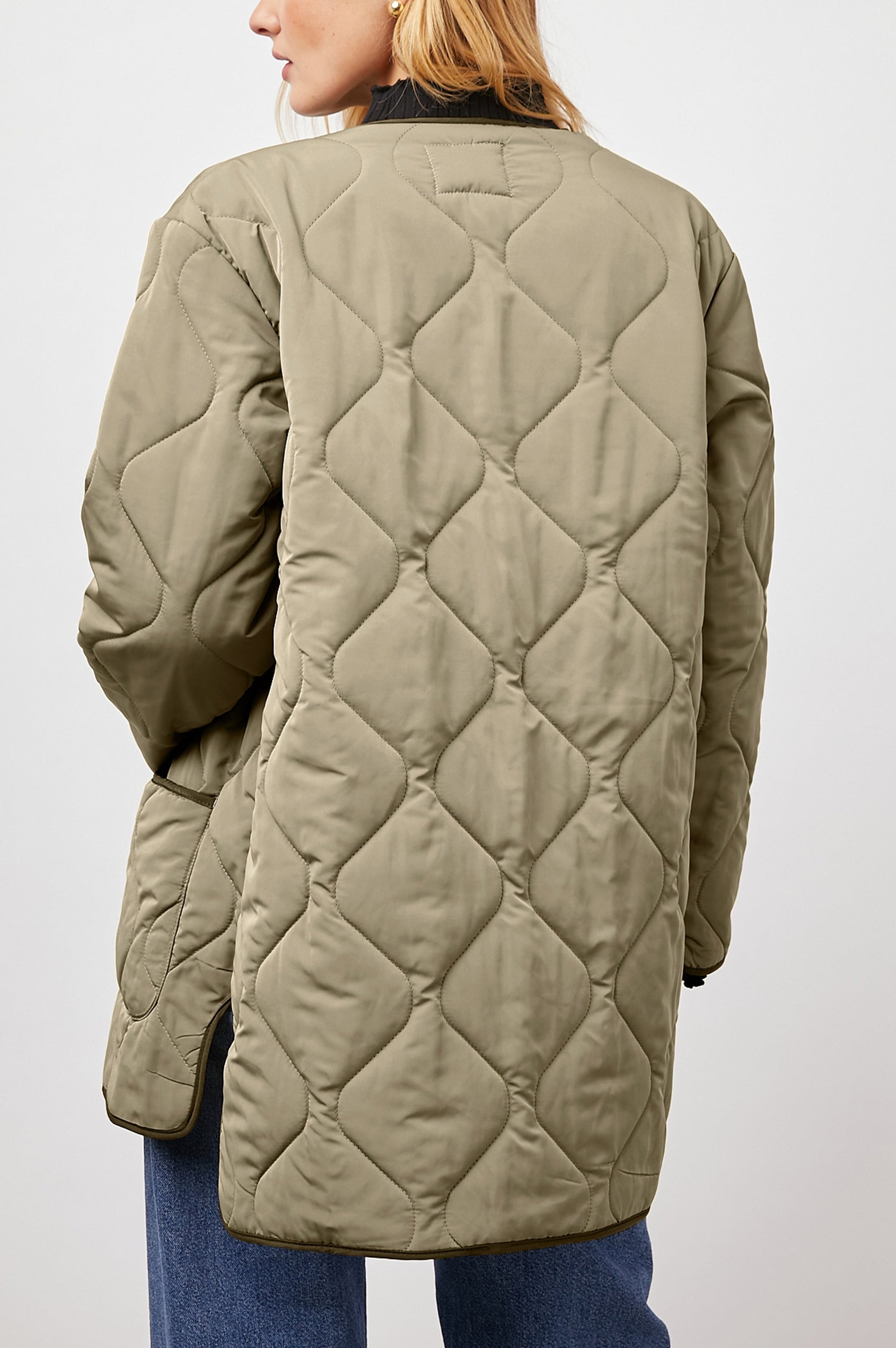 Elin Quilted Jacket with Button Closure, Side Slits, Low High Hem, Two Front Patch Pockets, and No Collar in Sage Colorway, with Darker Placket and Cuffs - Back View Featured on Model 