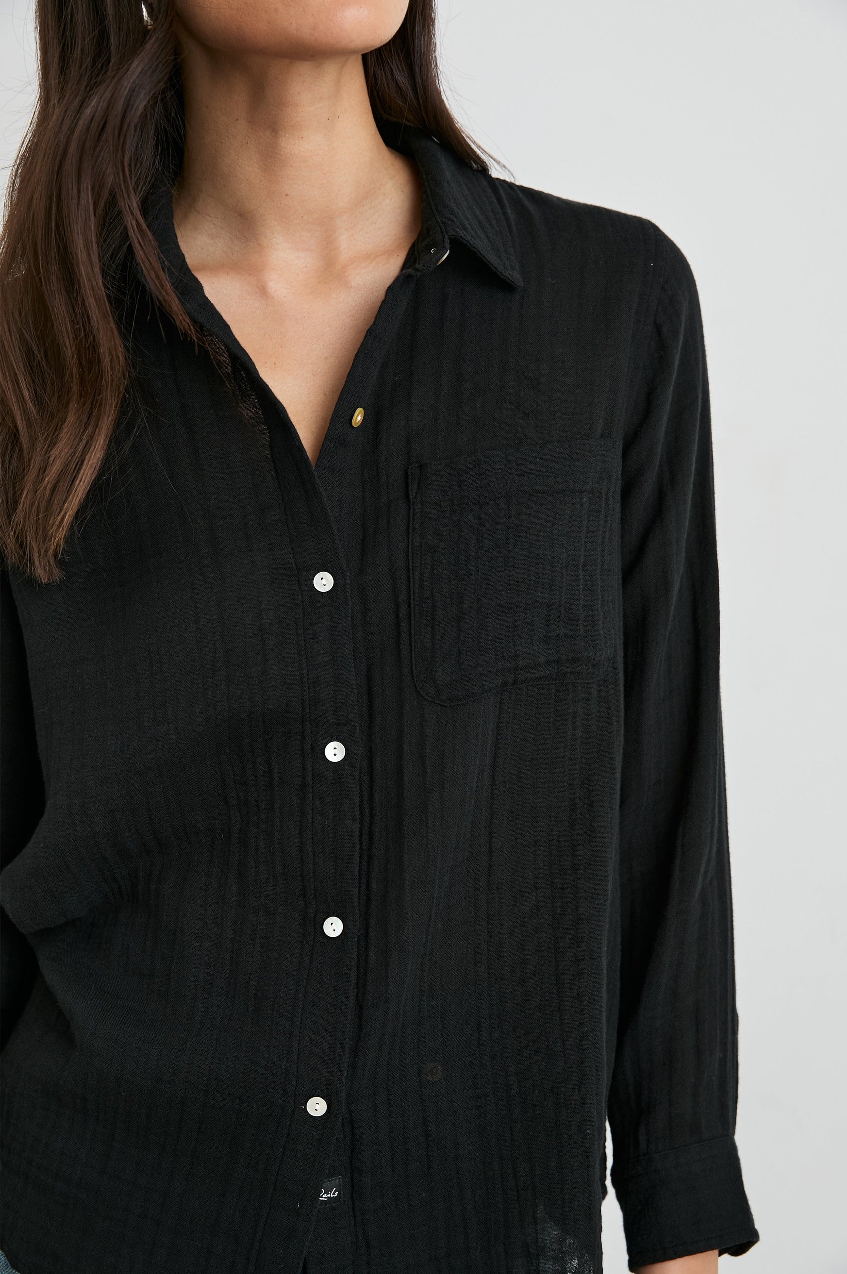 Ellis Long-Sleeve Button Down with Cuffs and a Front Chest Pocket in Black Colorway - Front Untucked View Featured on Model