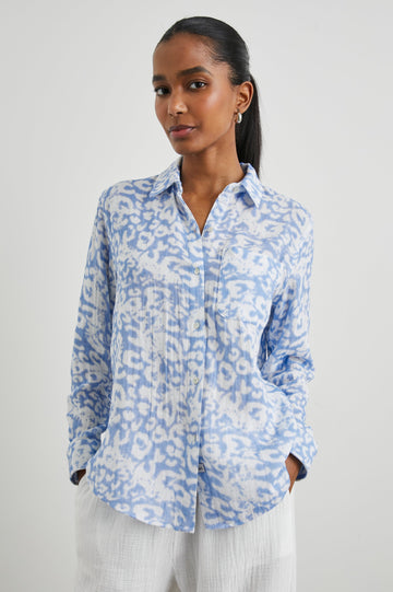 Ellis Long-Sleeve Button Down with Cuffs and a Chest Pocket in Blue Diffused Cheetah Colorway, with a diffused cheetah spot pattern - Front Untucked View Featured on Model