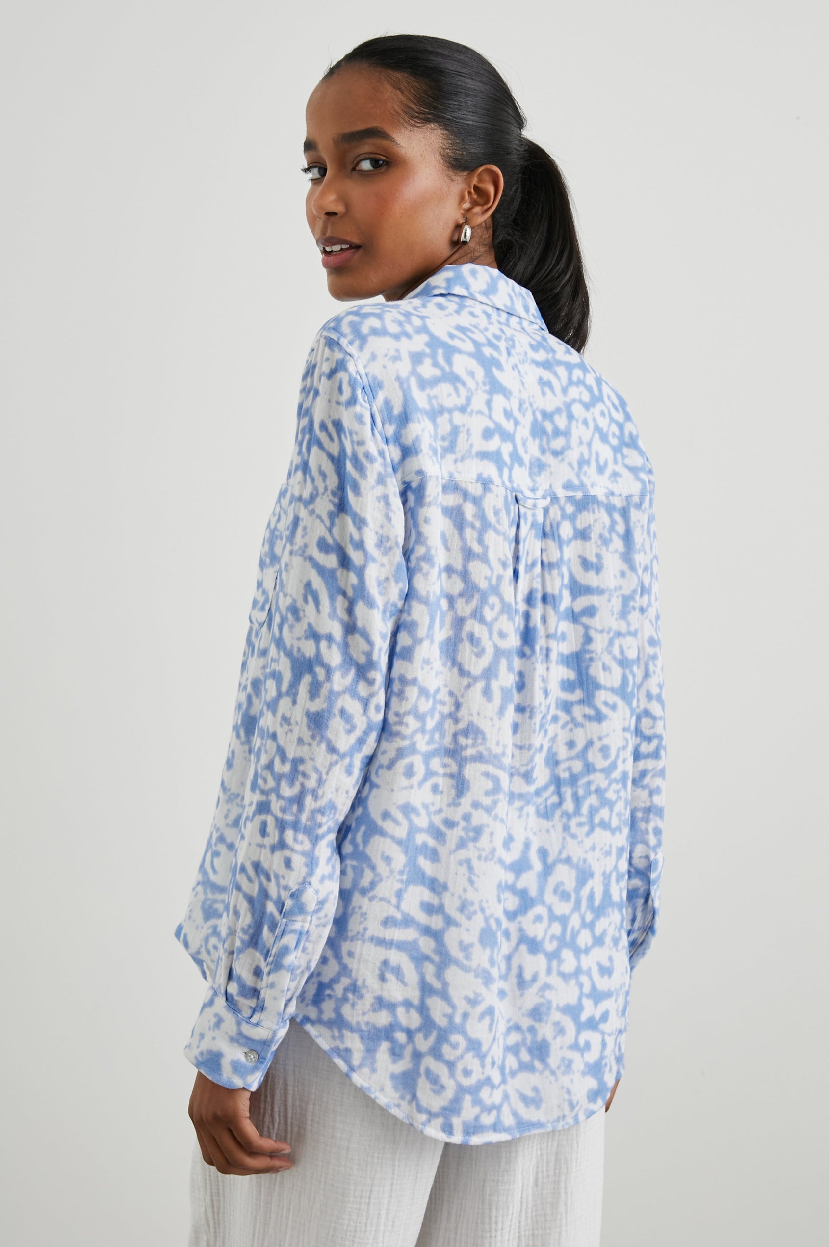 Ellis Long-Sleeve Button Down with Cuffs and a Chest Pocket in Blue Diffused Cheetah Colorway, with a diffused cheetah spot pattern - Back Untucked View Featured on Model