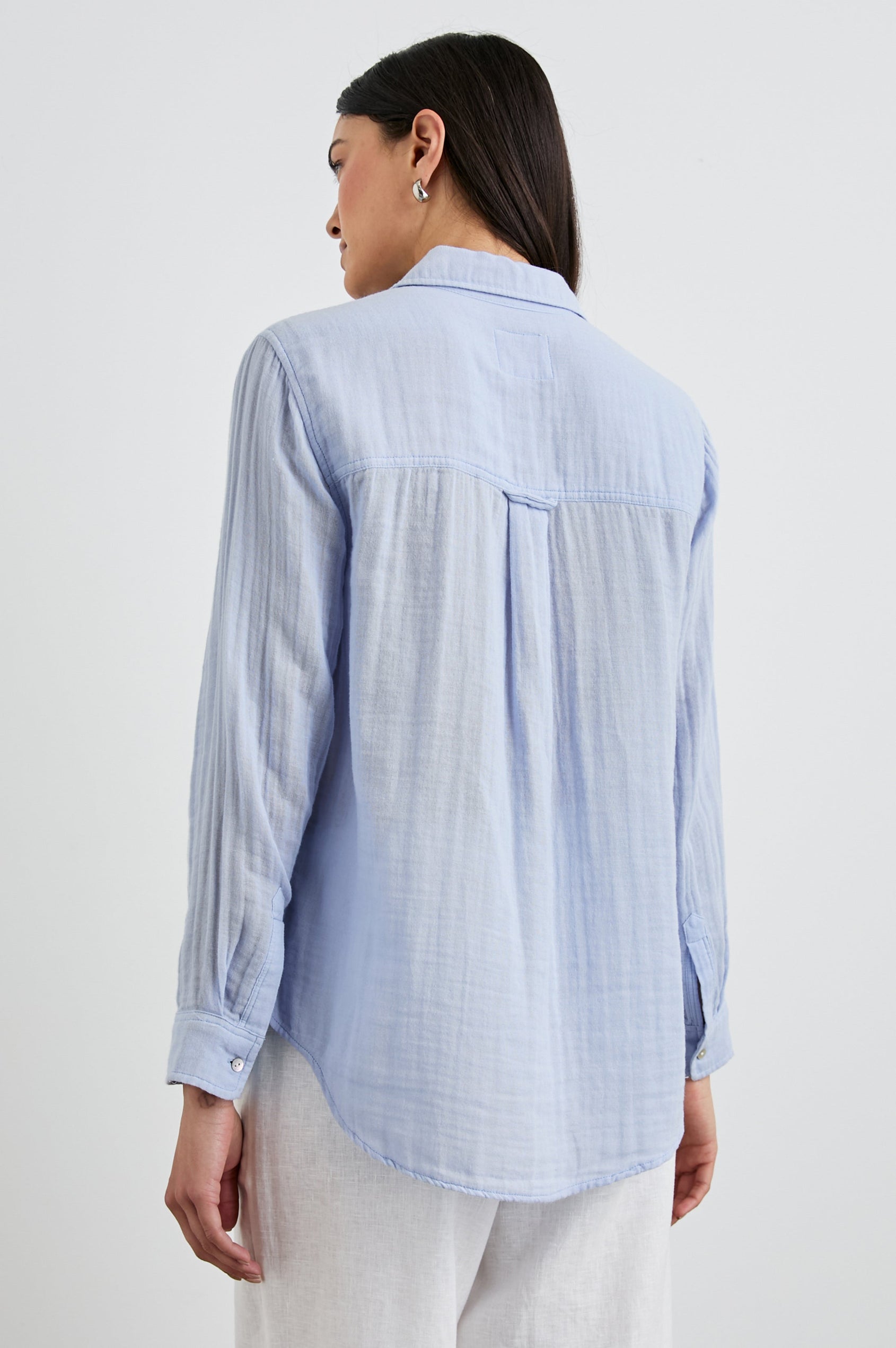 Ellis Long-Sleeve Button Down with Cuffs and a Patch Chest Pocket in Bluebell Colorway - Back Untucked View Featured on Model