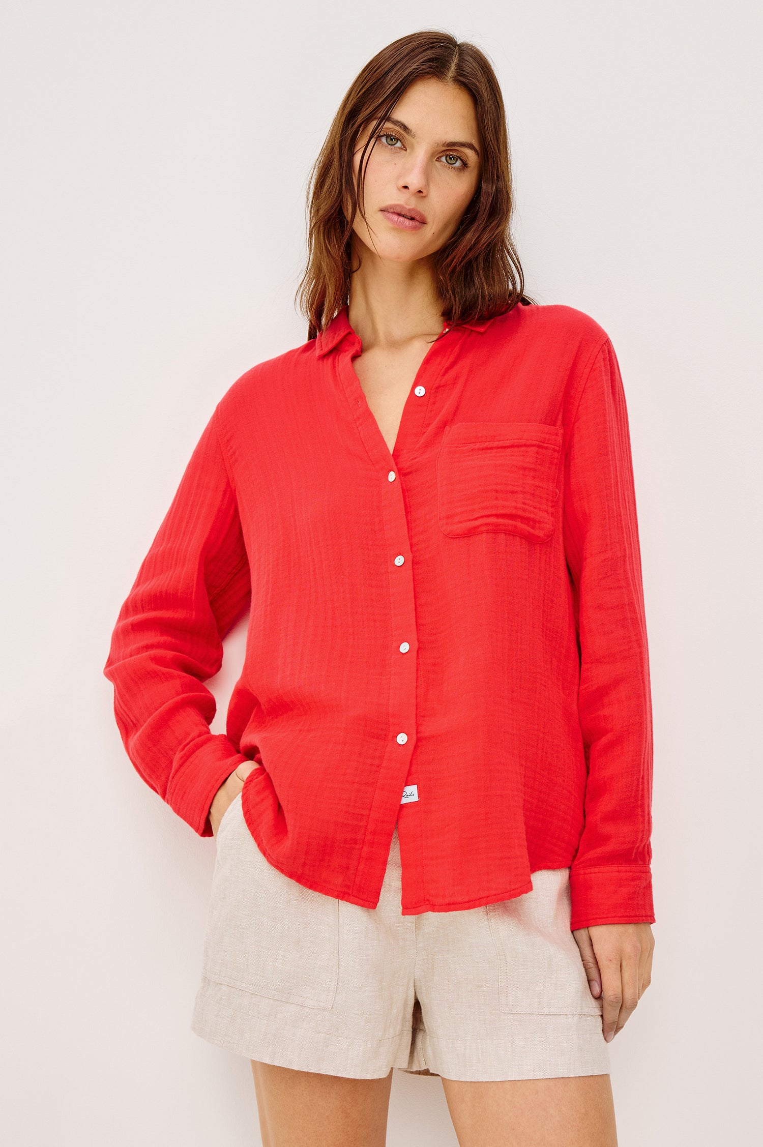 Ellis Relaxed Collared Button Front Shirt with Long Sleeves and a Chest Pocket in cherry red Colorway. Front View Shown on Model.