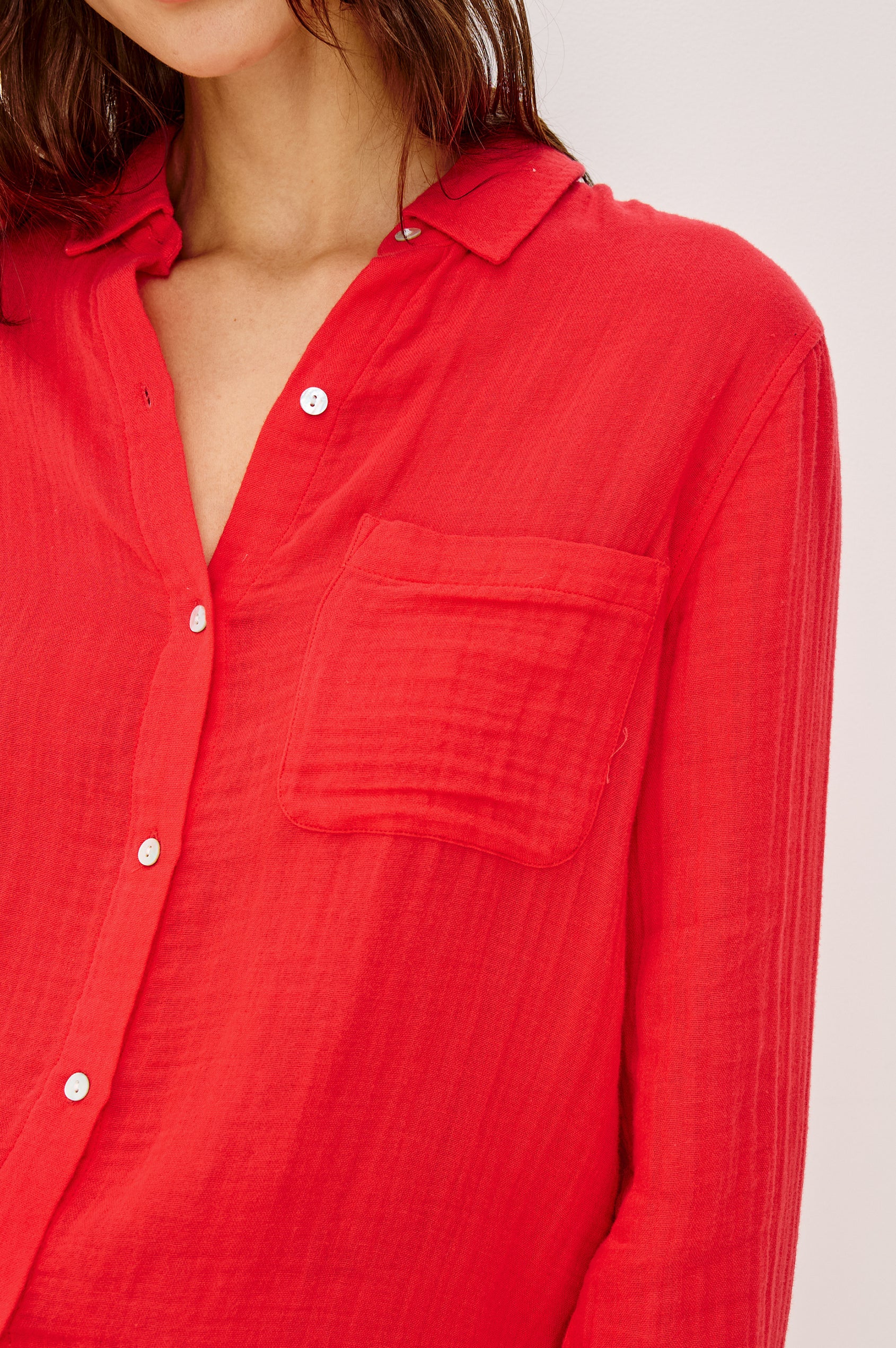 Ellis Relaxed Collared Button Front Shirt with Long Sleeves and a Chest Pocket in cherry red Colorway. Front View Shown on Model.