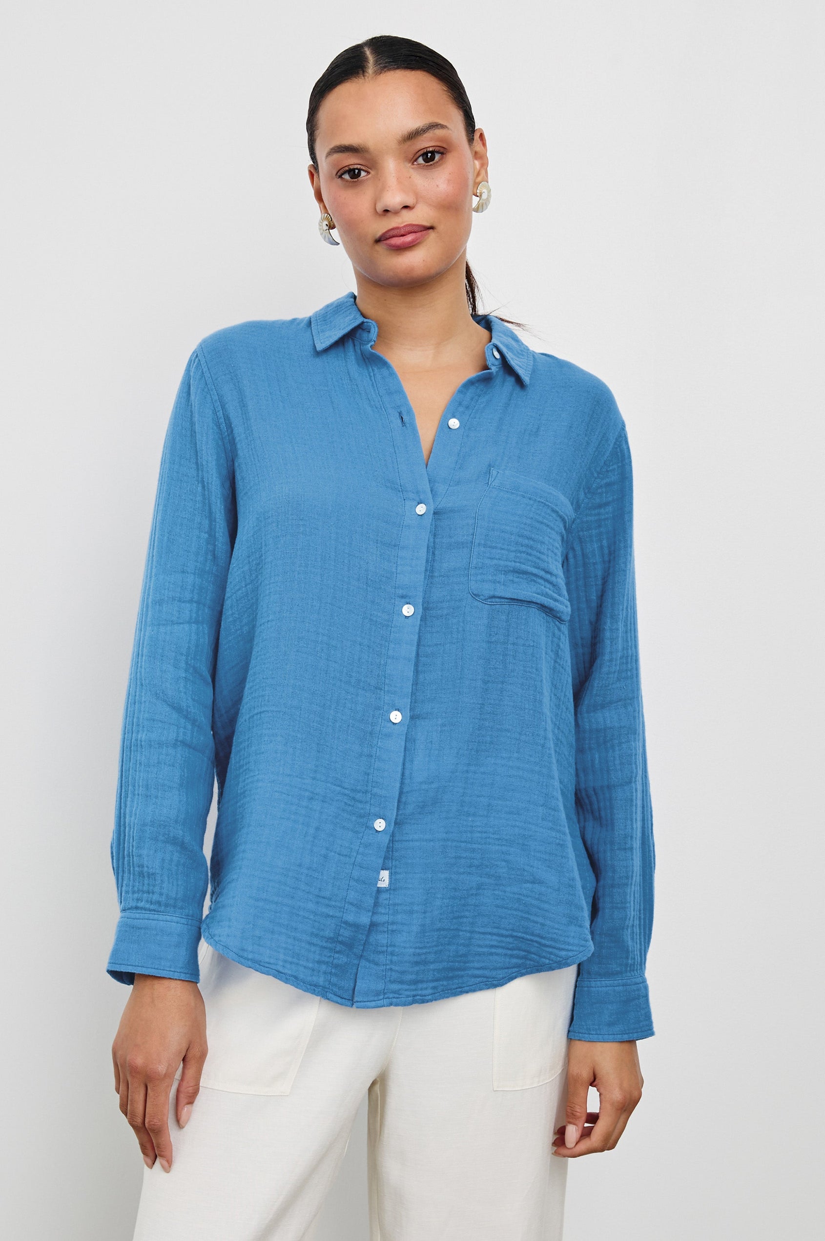 Ellis Relaxed Collared Button Front Shirt with Long Sleeves and a Chest Pocket in French Blue Colorway. Front View Shown on Model.