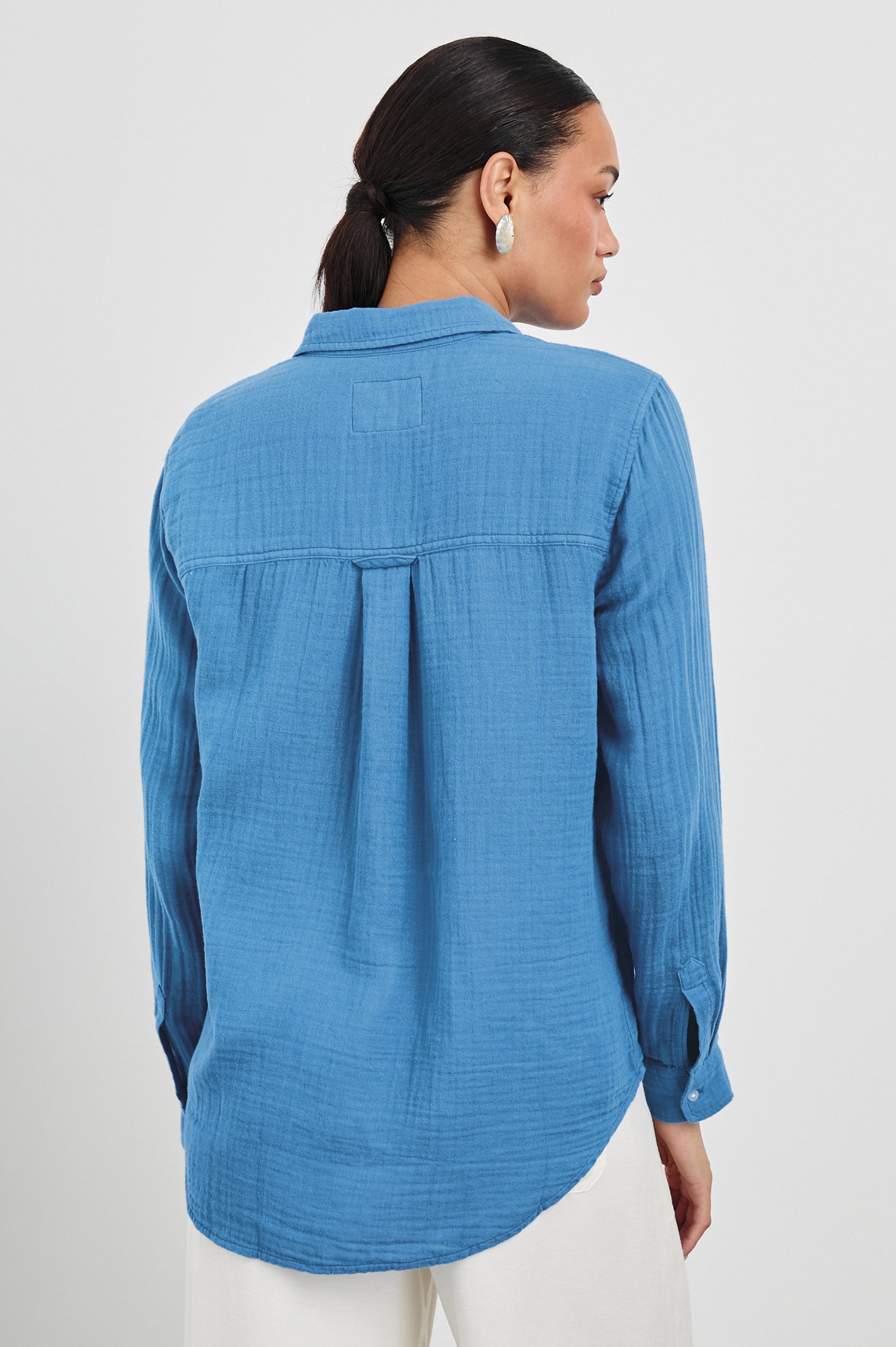 Ellis Relaxed Collared Button Front Shirt with Long Sleeves and a Chest Pocket in French Blue Colorway. Back View Shown on Model.