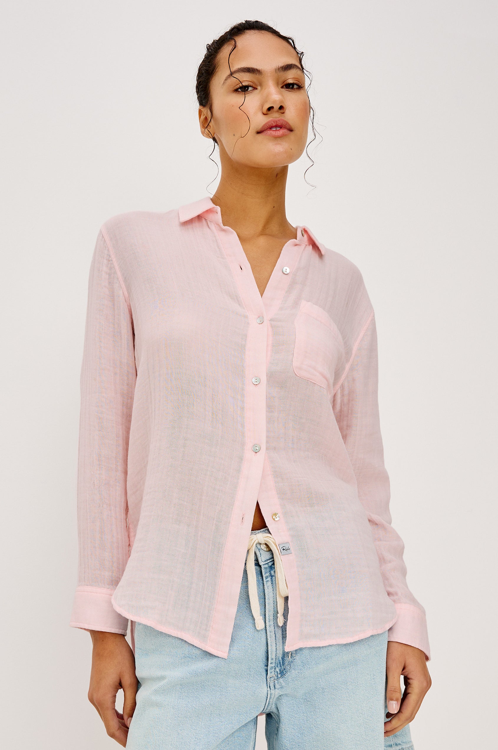 Ellis Relaxed Collared Button Front Shirt with Long Sleeves and a Chest Pocket in Baby Pink Colorway. Upper Body Front View Details Shown on Model.