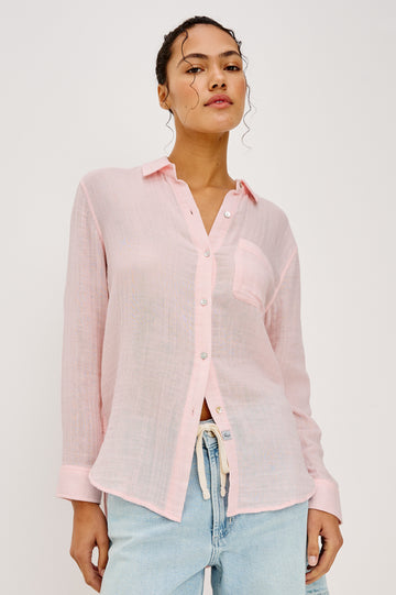 Ellis Relaxed Collared Button Front Shirt with Long Sleeves and a Chest Pocket in Baby Pink Colorway. Upper Body Front View Details Shown on Model.