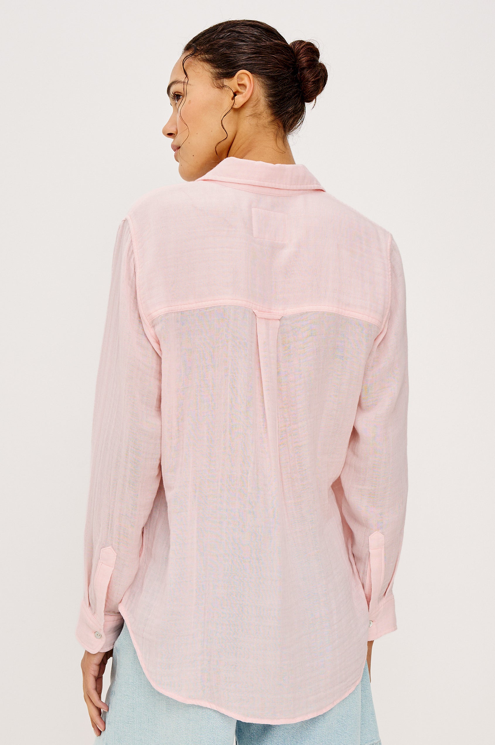Ellis Relaxed Collared Button Front Shirt with Long Sleeves and a Chest Pocket in Baby Pink Colorway. Upper Body Back View Details Shown on Model.